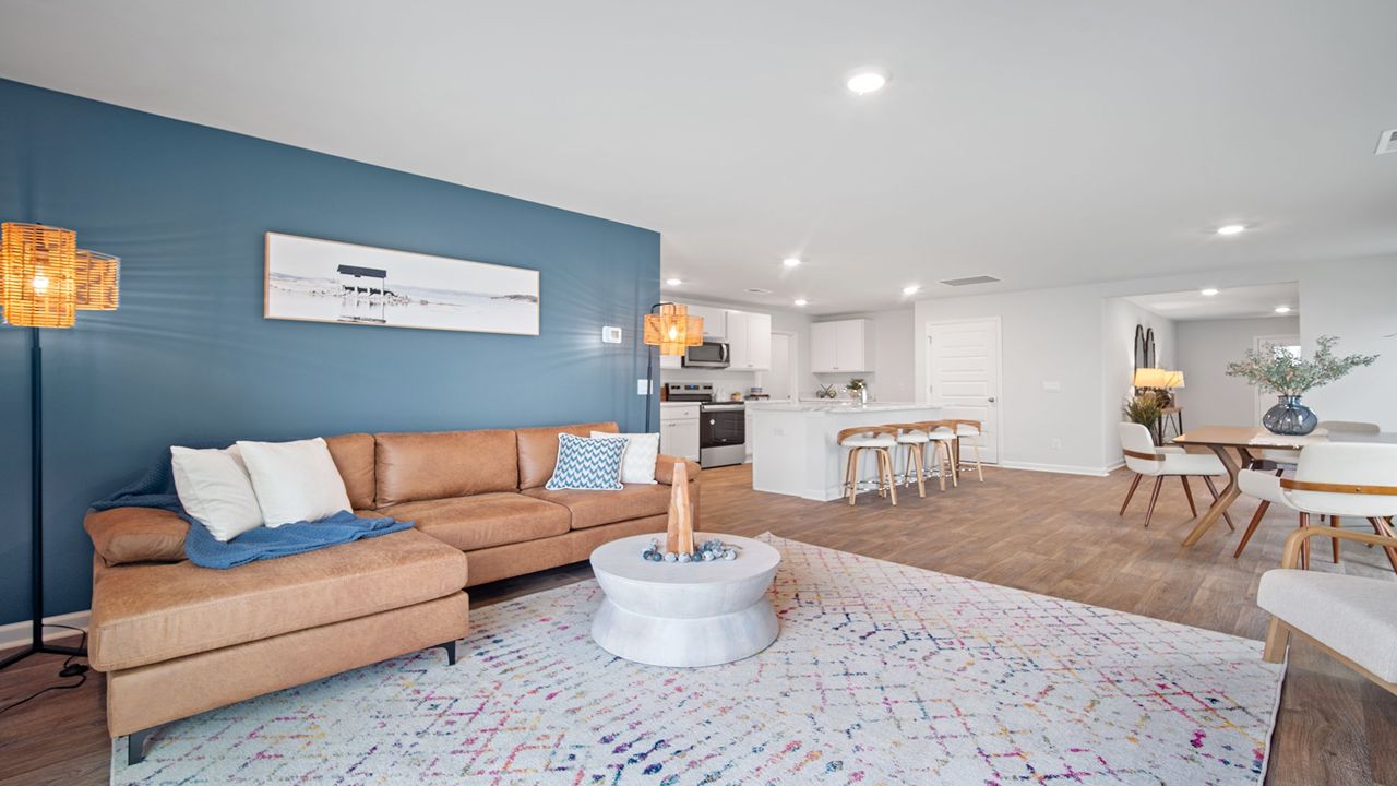 Living room of home decorated with a couch and table