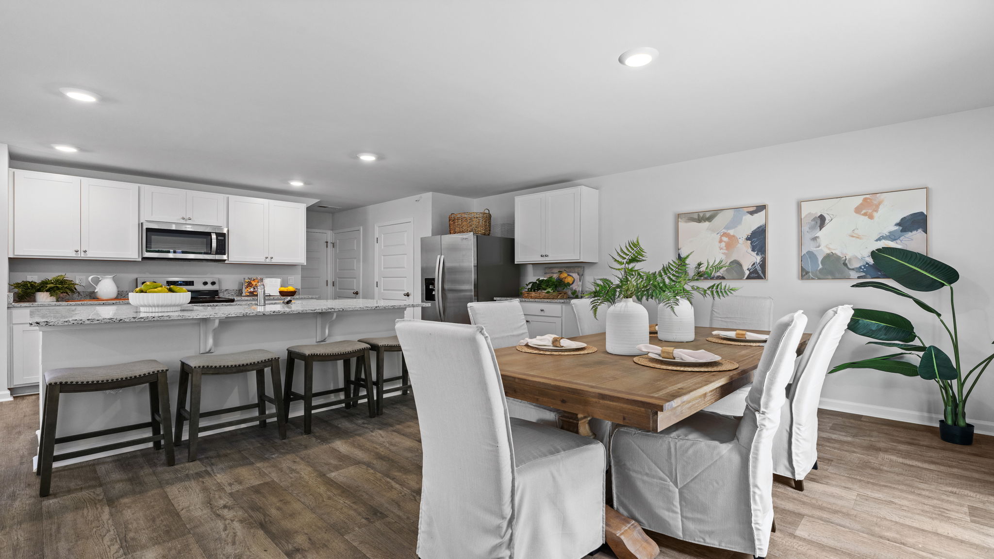 Open dining space in the Downing floor plan at Rice Hope featuring seamless connectivity to the kitchen, modern finishes, and a comfortable atmosphere for everyday dining and special occasions.