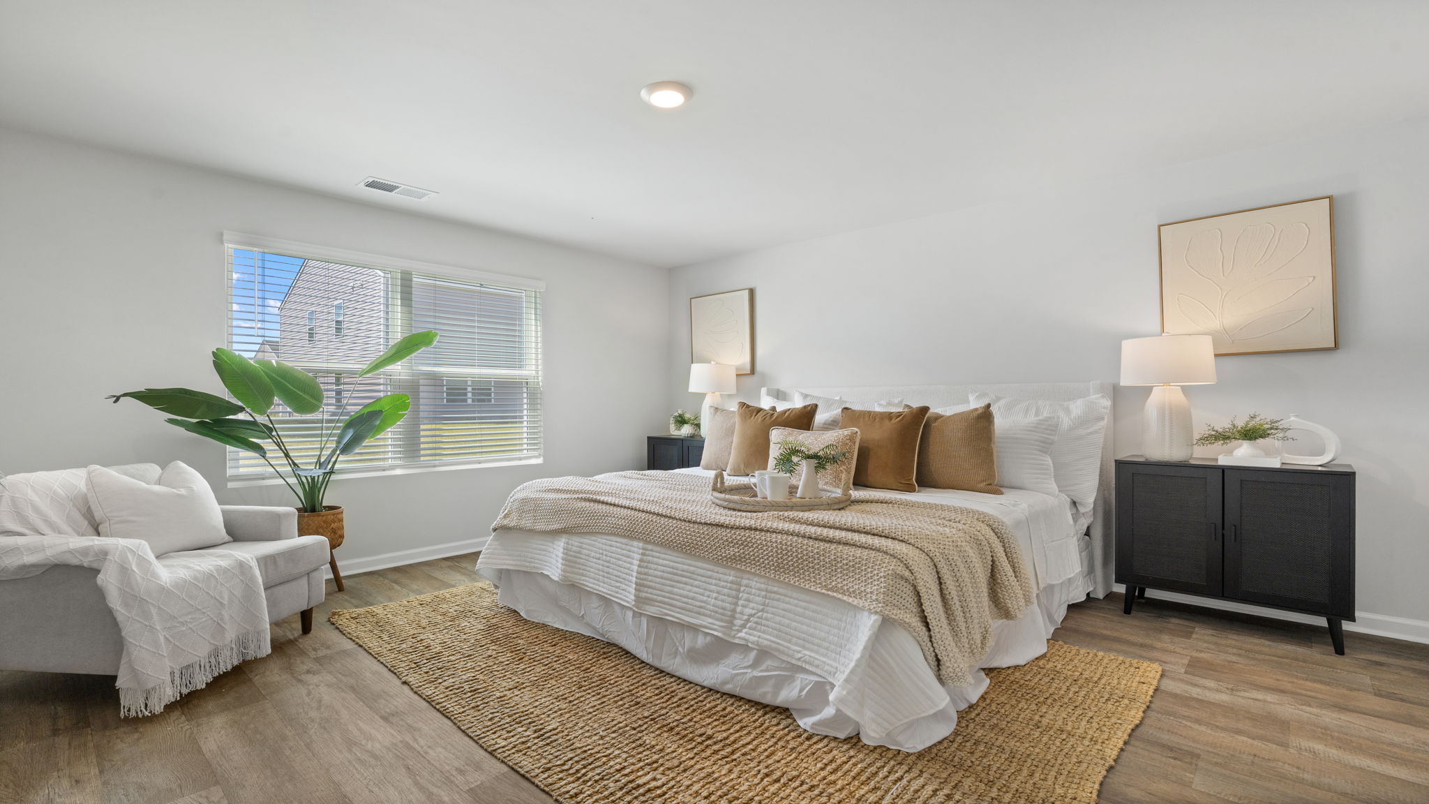 Allex A Primary Bedroom Alternate View | Primary bedroom featuring bright finishes and ample space.