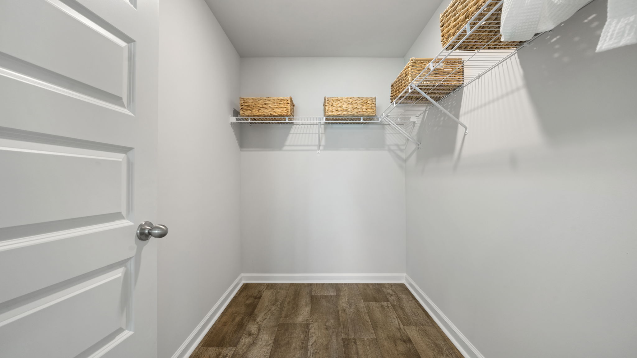 Allex A Walk-In Closet | Walk-in closet located within the primary suite.