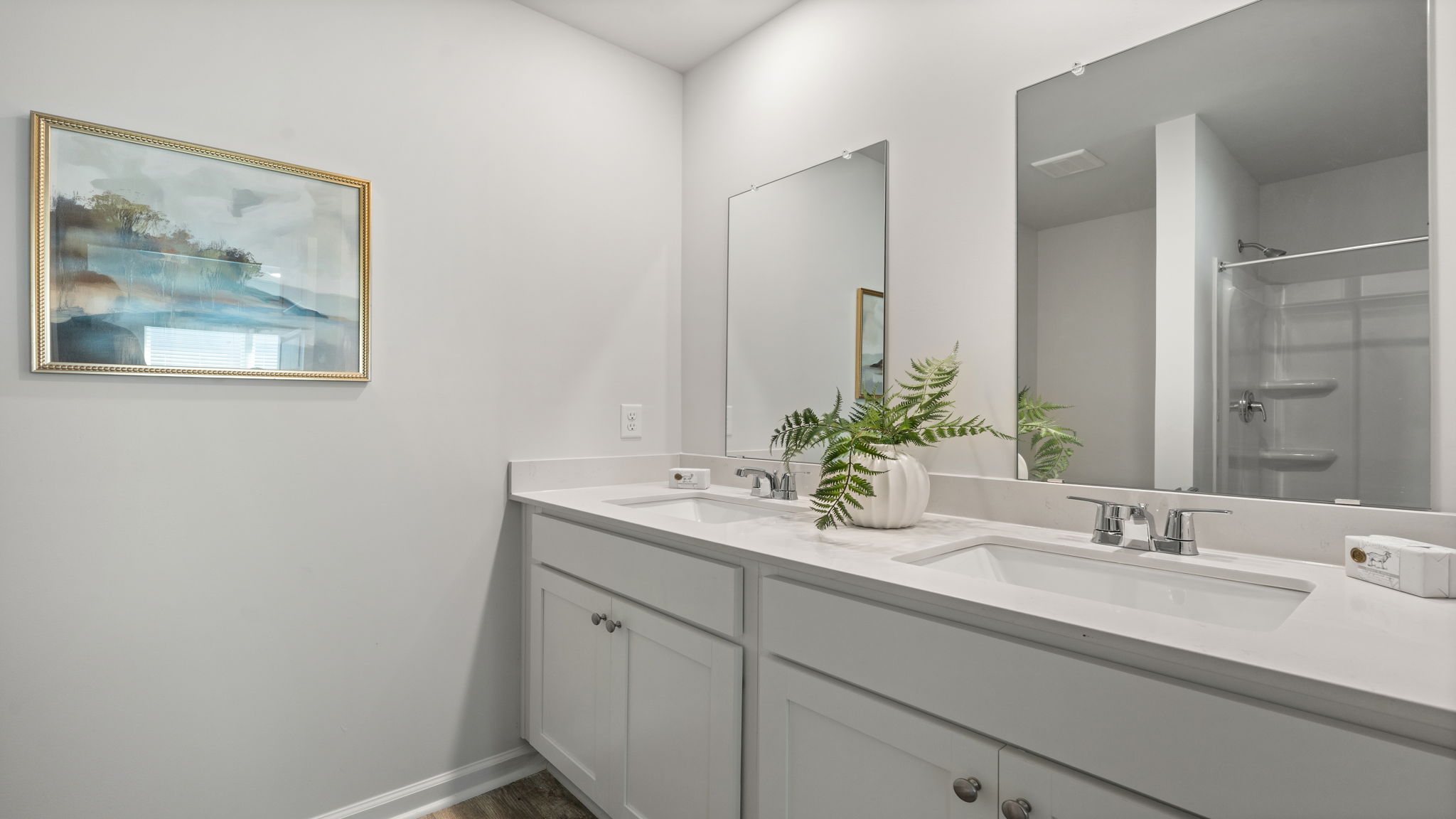 Allex A Primary Bathroom Vanity | Spacious vanity area with ample storage and lighting.