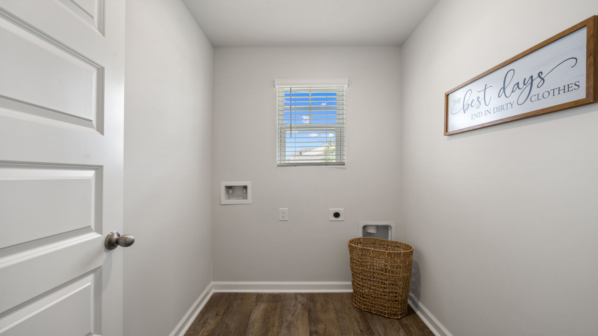 Allex A Laundry Room | Dedicated laundry room with storage and utility space.