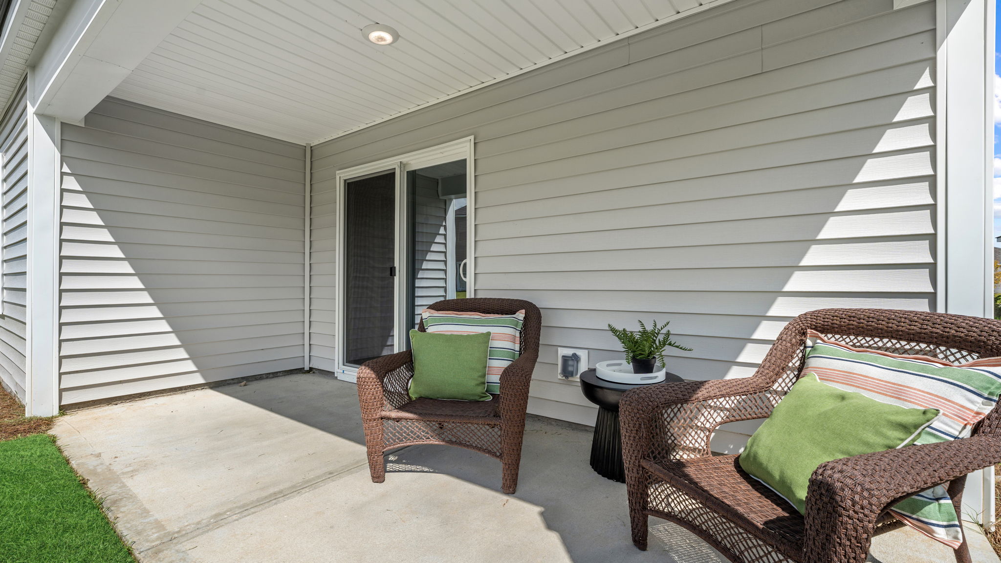 Allex A Covered Rear Patio | Covered outdoor living area overlooking the backyard.