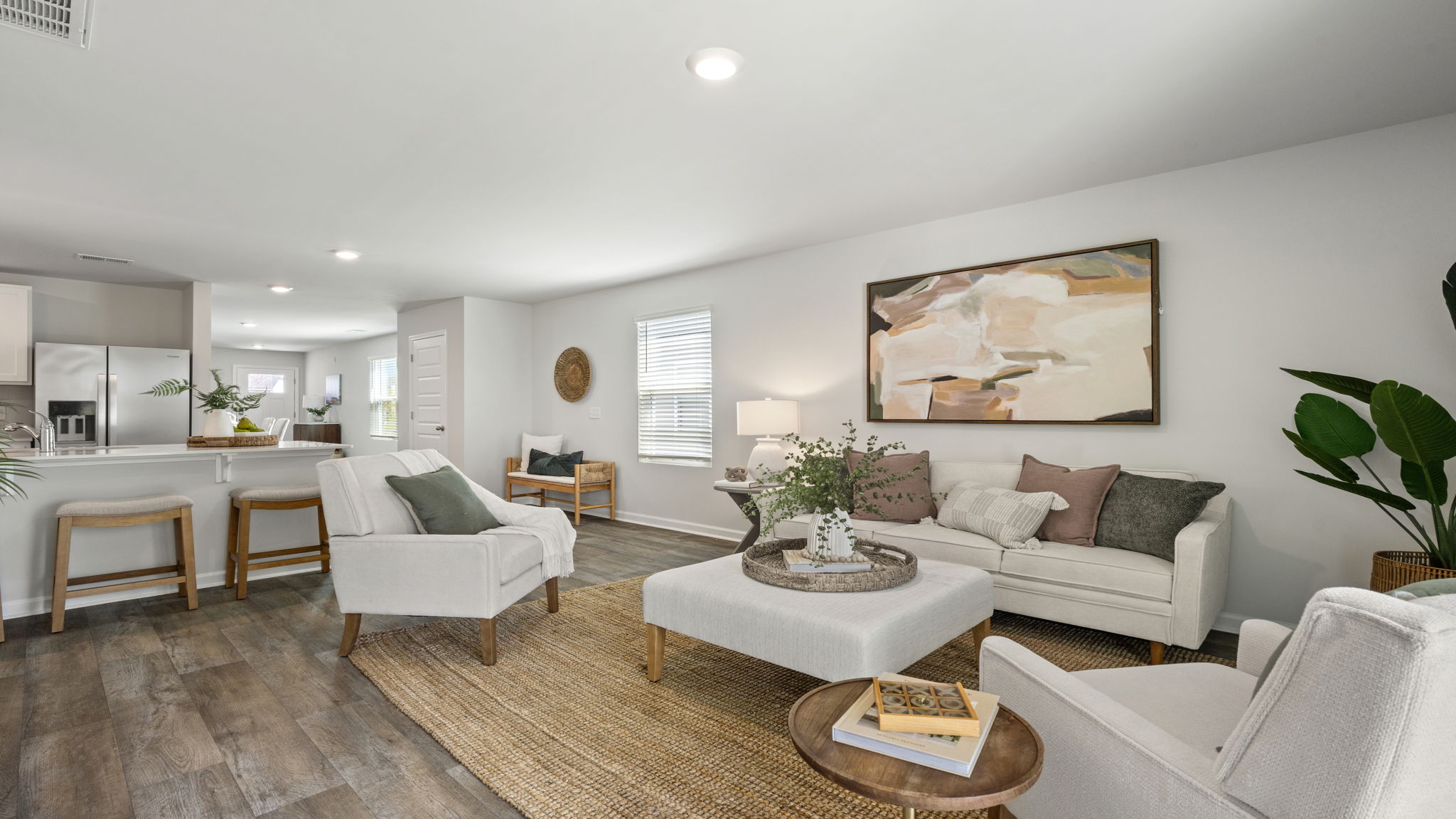 Allex A Open-Concept Living Area | Spacious living room flowing into the kitchen and dining area