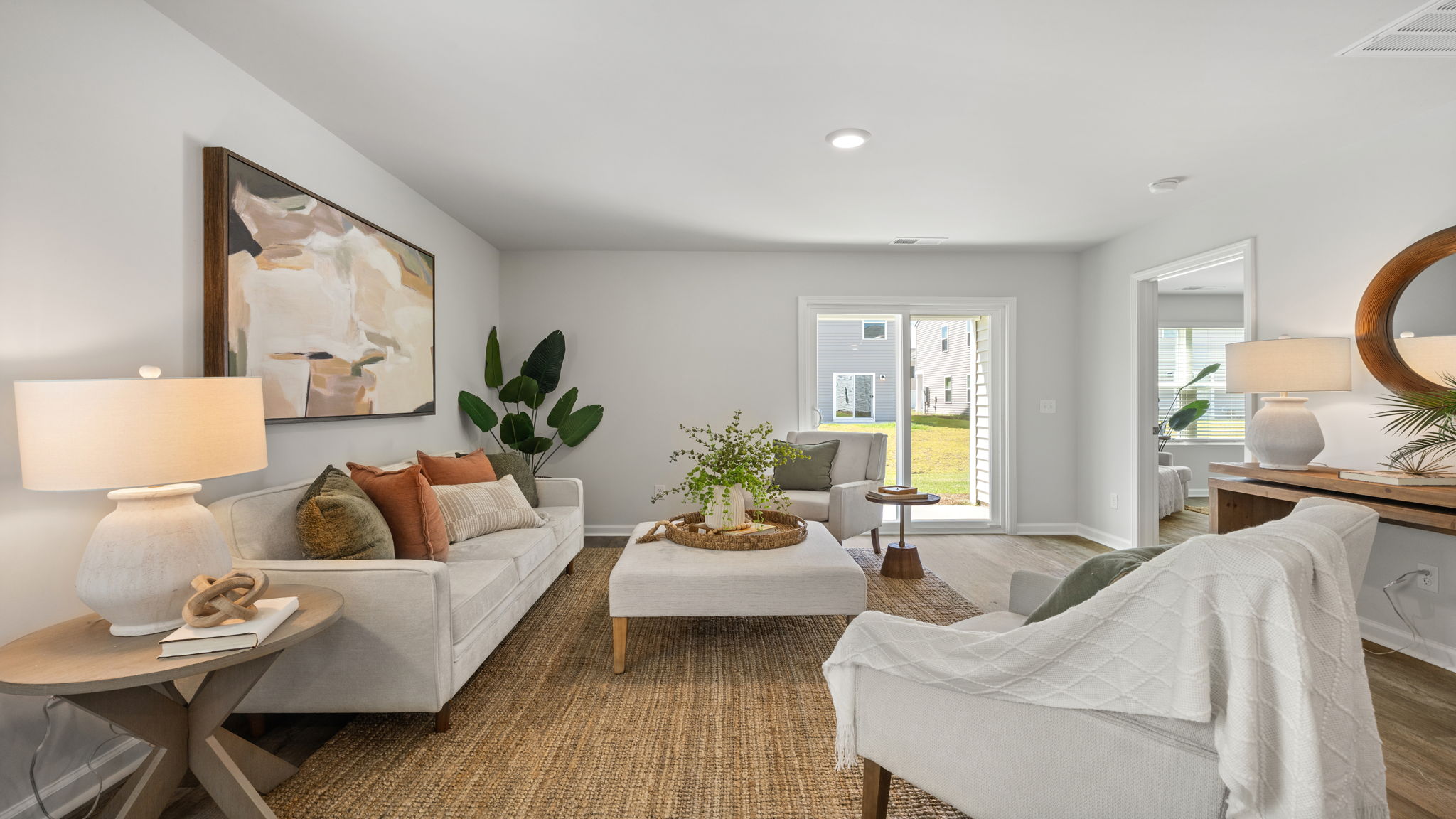 Allex A Living Room Alternate View | Open-concept living space with abundant natural light.