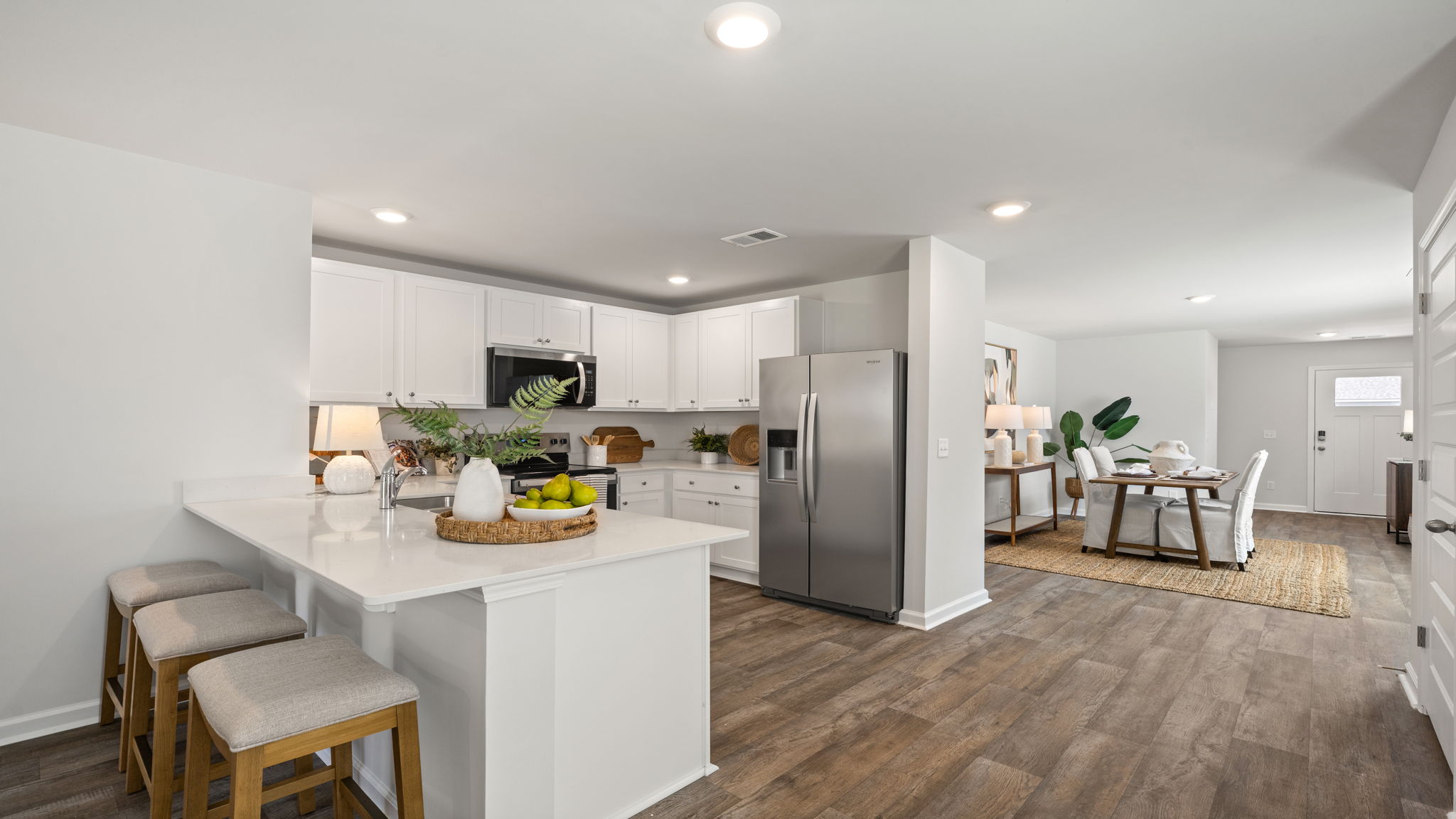 Allex A Kitchen and Living Space | View from kitchen overlooking the open-concept living room.