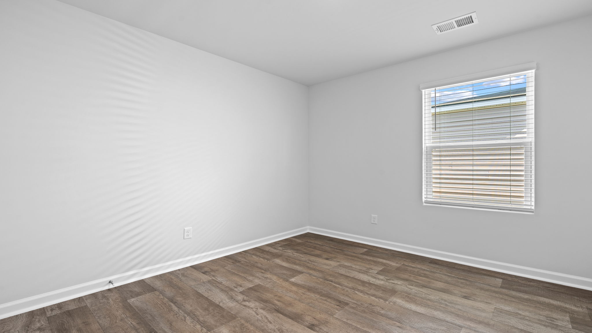 Additional bedroom in Rice Hope's Willow floor plan offering functional space, privacy, and attractive design details.