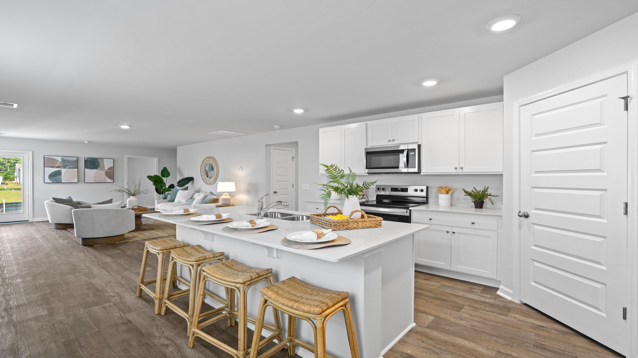 Chef-inspired Willow kitchen with contemporary finishes, pantry storage, stainless appliances, and functional open-concept layout.