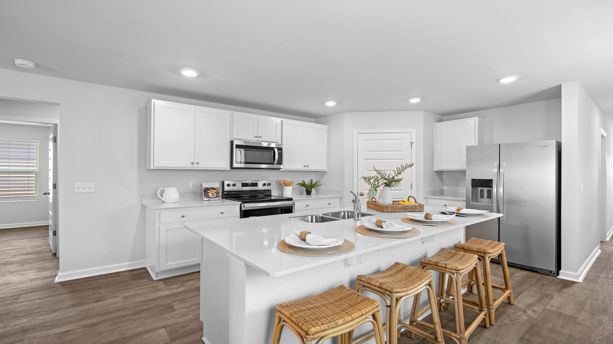 Bright kitchen in the Willow by D.R. Horton with modern cabinetry, ample counter space, and an open-concept layout.