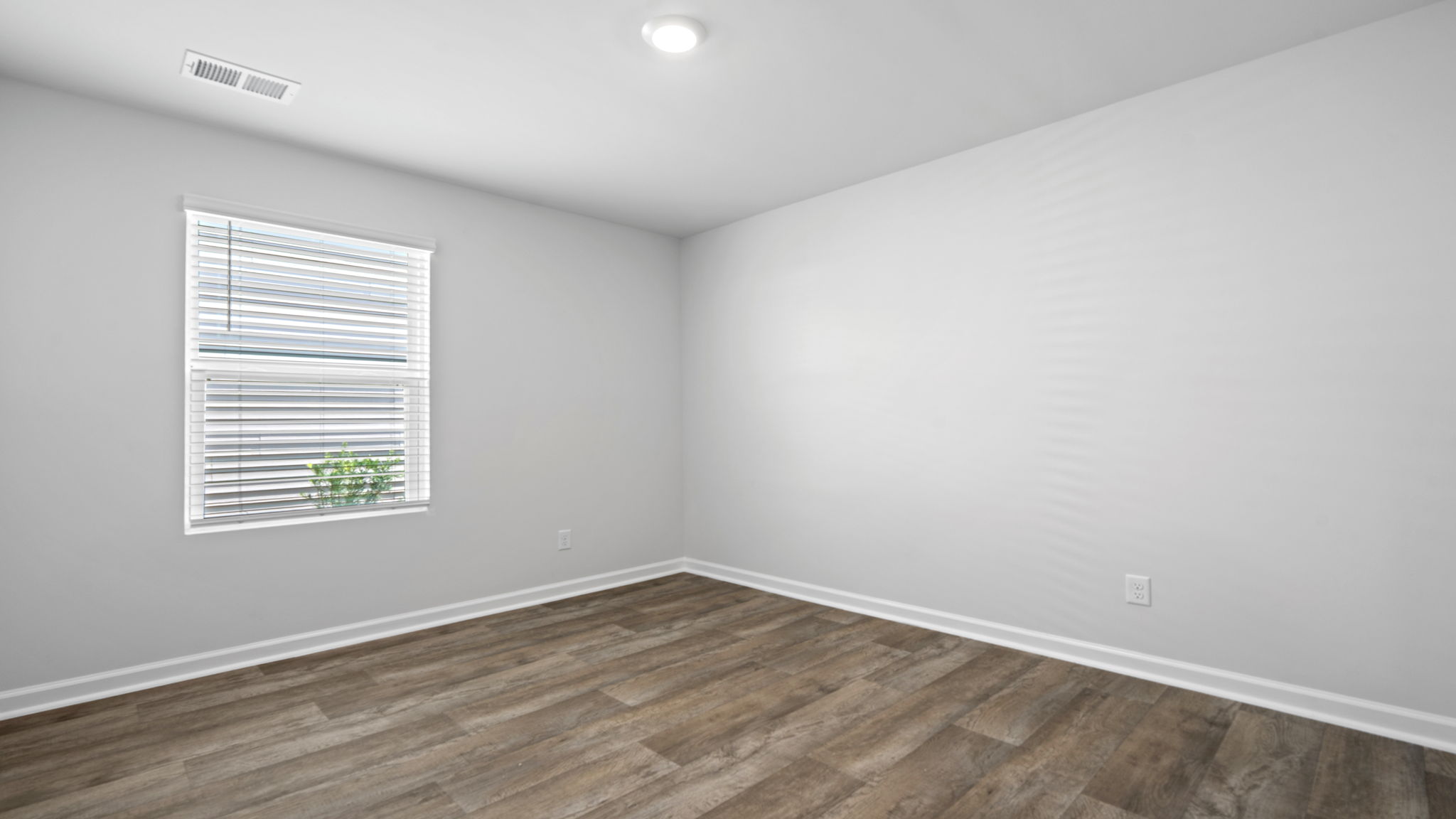 Secondary bedroom in the Willow by D.R. Horton offering flexible space for guests, family members, or a home office.