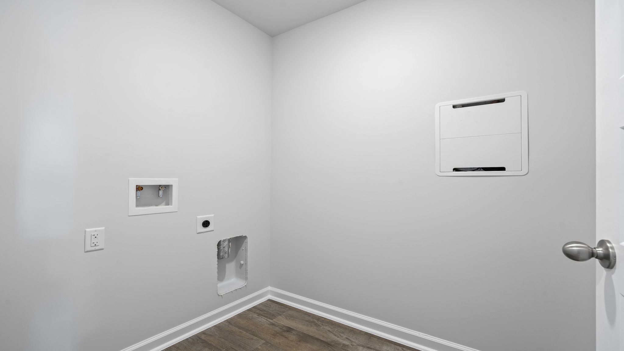 Convenient laundry room in the Willow floor plan designed for efficient household organization.