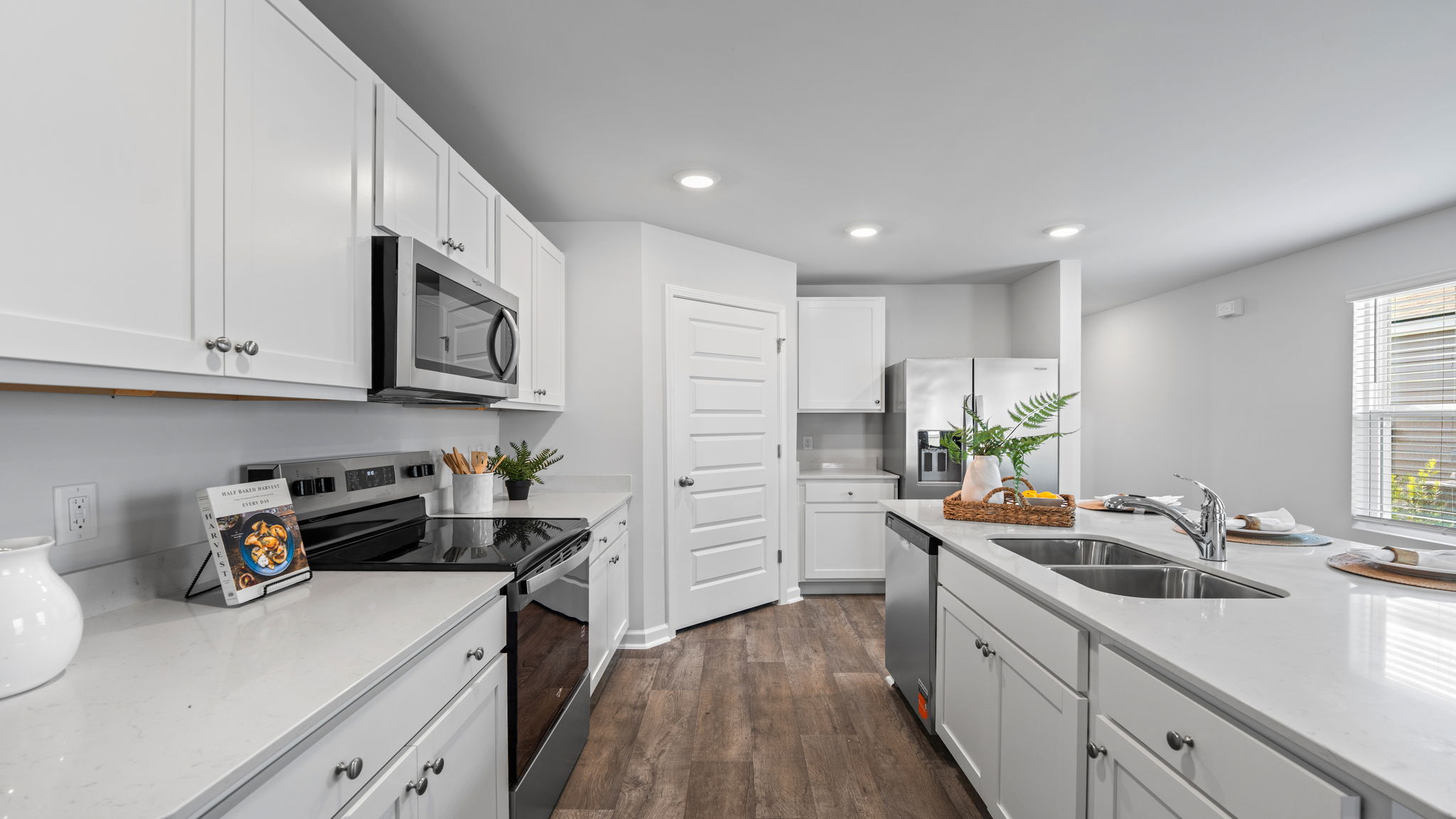 Spacious Willow kitchen featuring convenient meal prep space and easy access to dining and living areas.