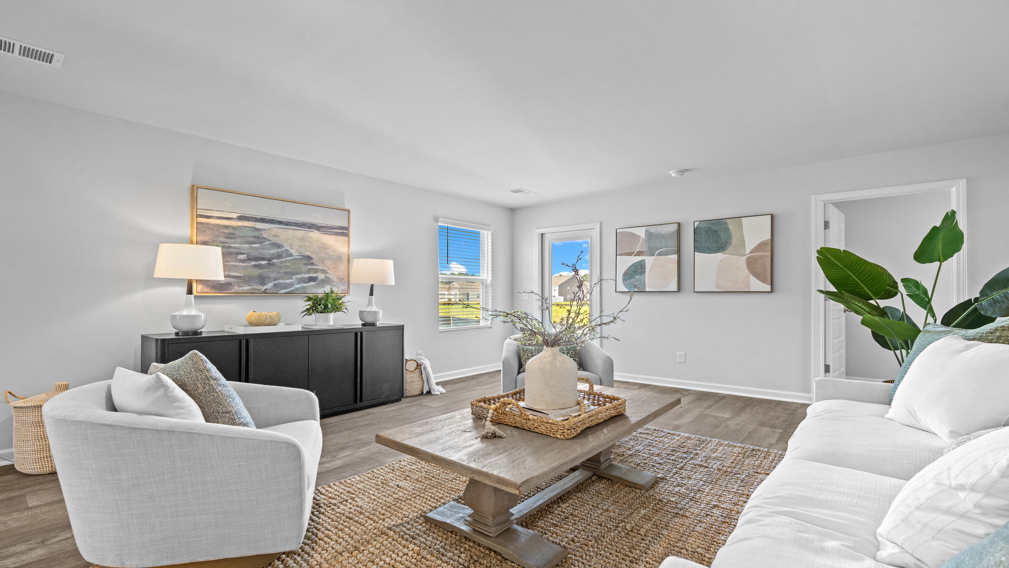 Open-concept family room in the Willow designed for relaxation and connection with adjacent living spaces.