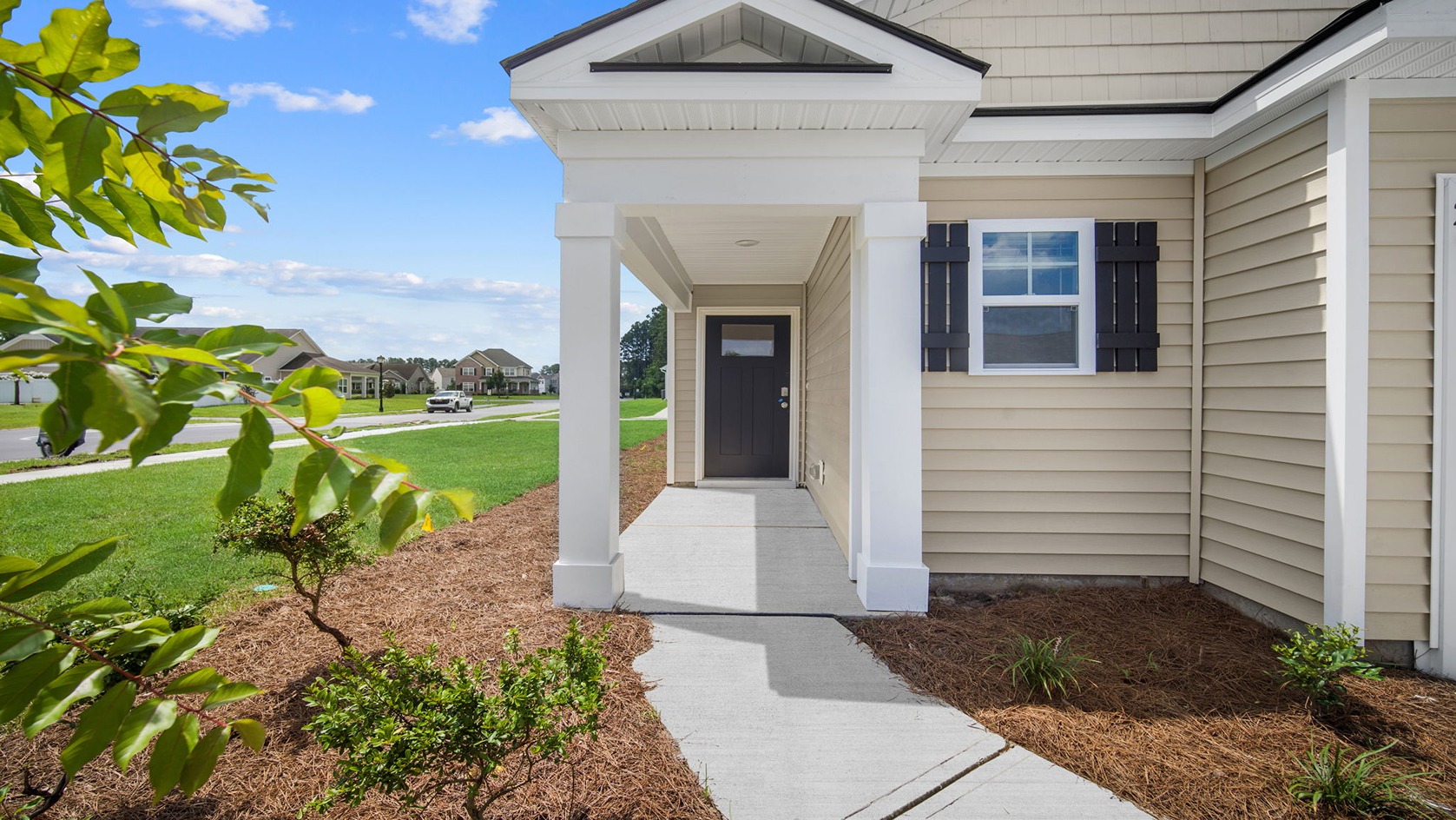 Front porch area with entryway and outdoor details.