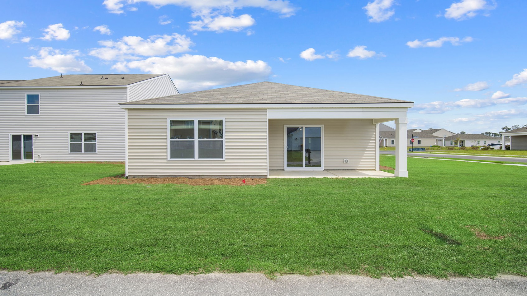 Rear of home with a covered patio