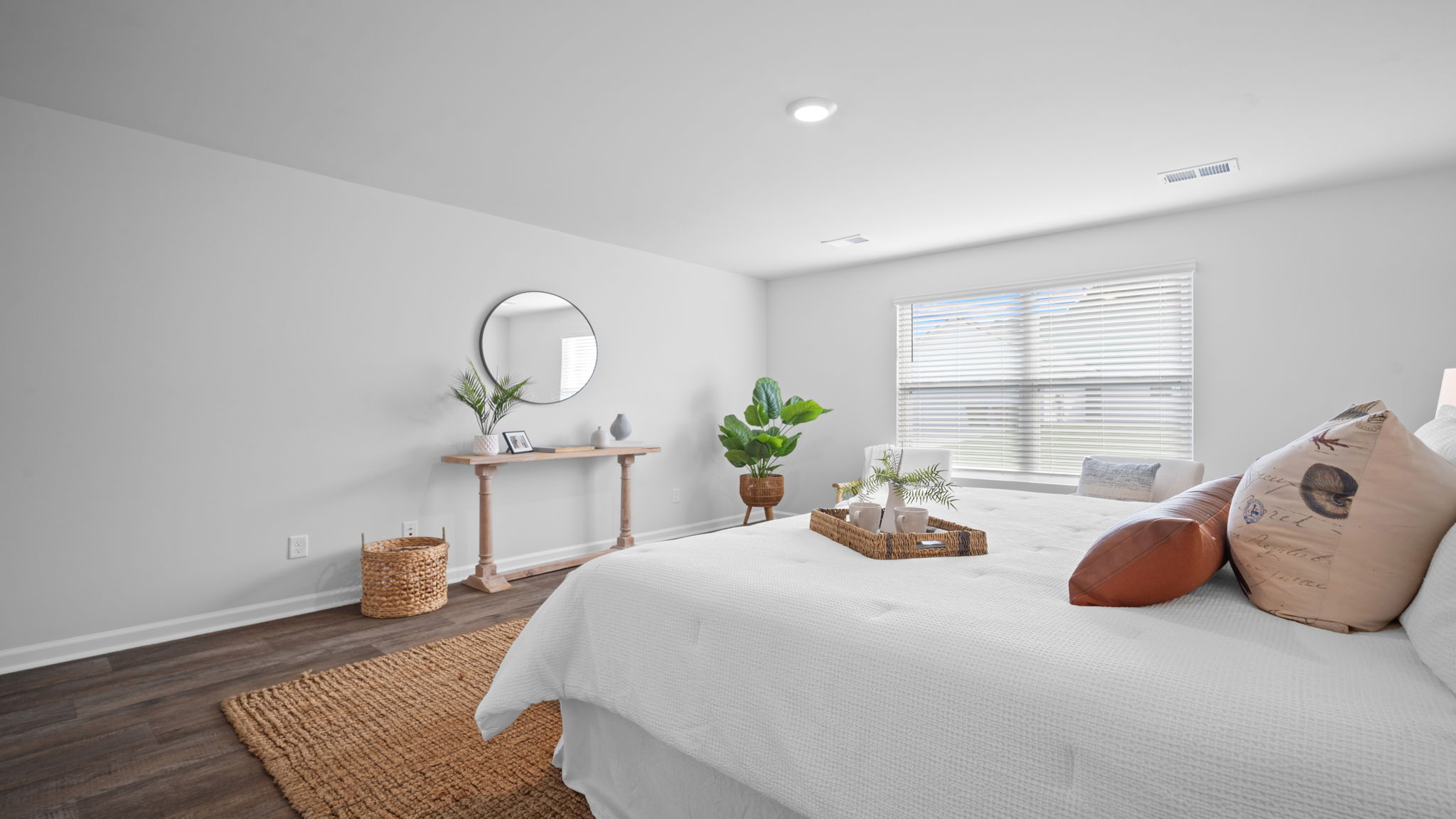 Alternate angle of the primary bedroom and furnishings.