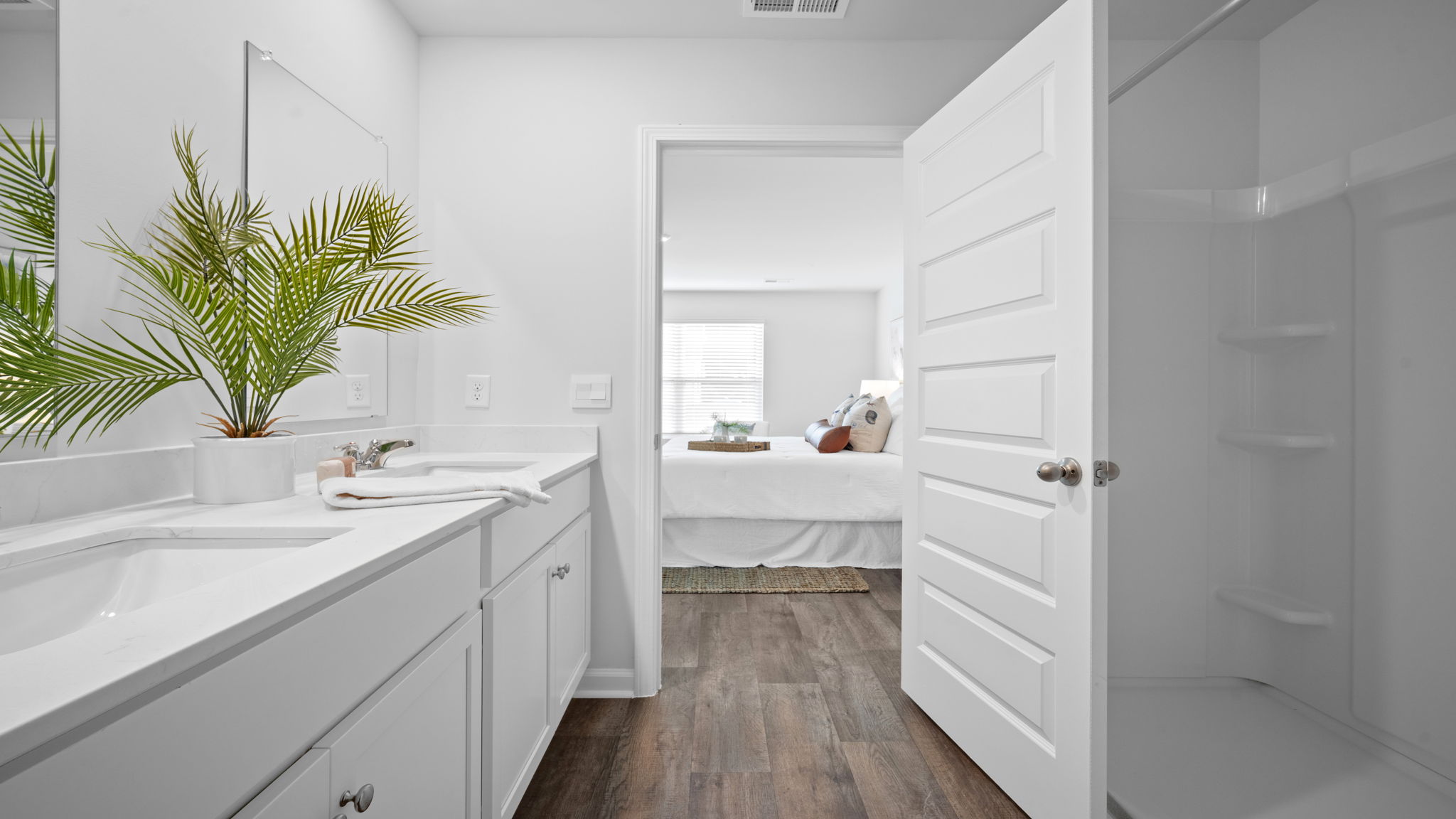 Alternate primary bathroom view showing vanity and fixtures.