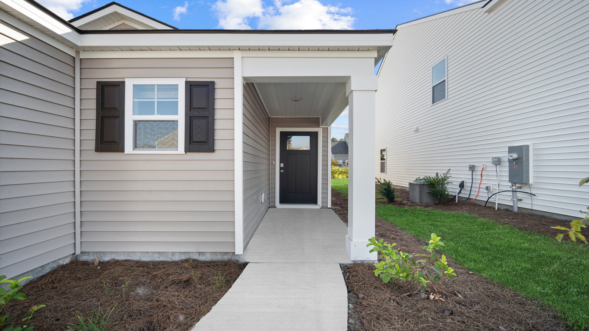 Front porch area with entryway and outdoor details.