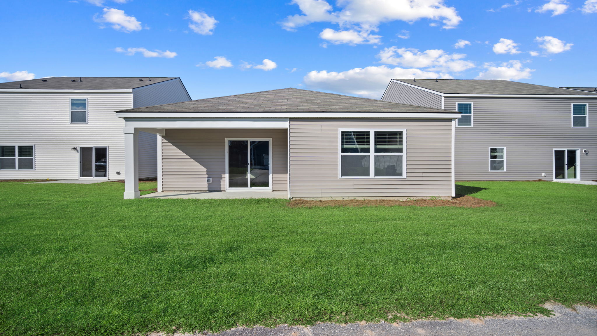 Rear of home with a covered patio