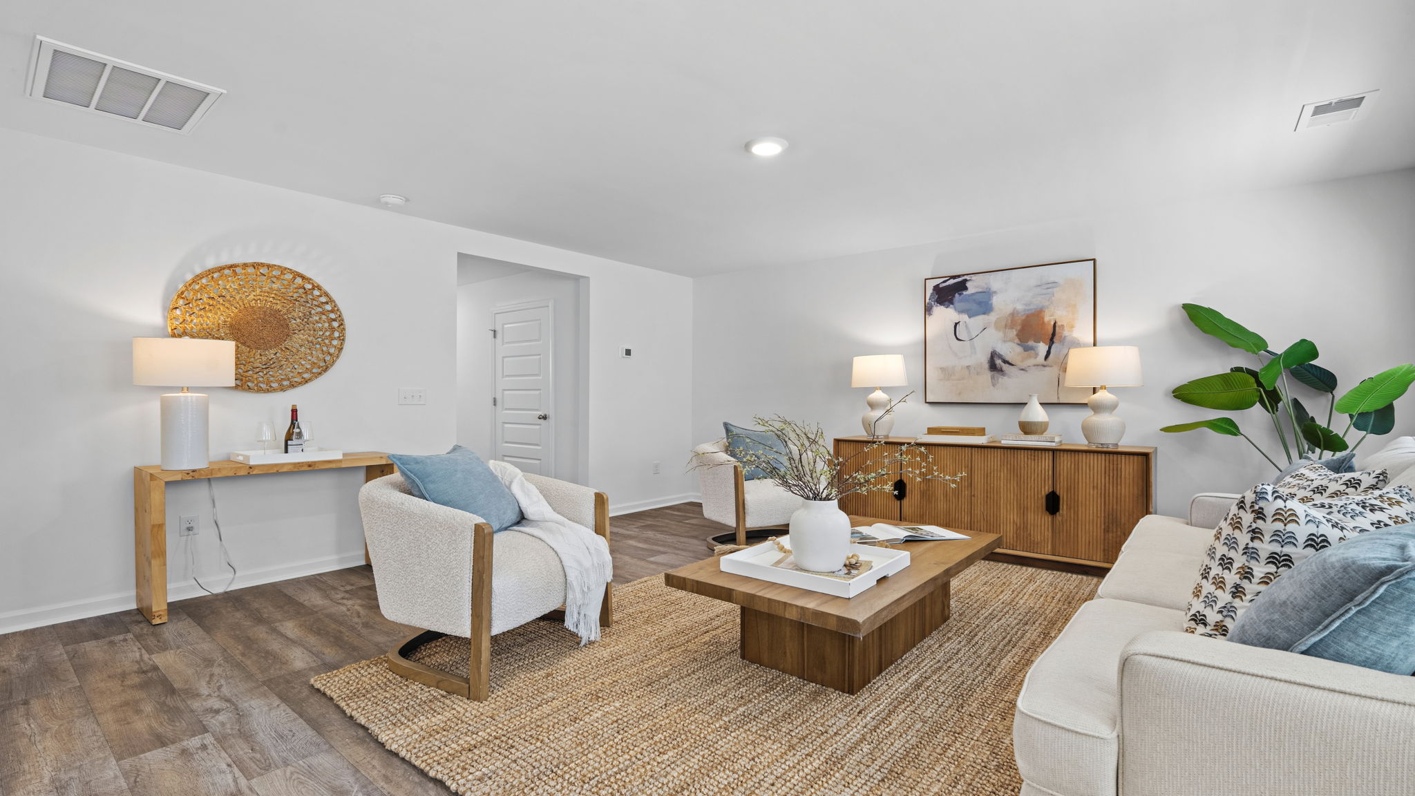 Family room and gathering space with modern finishes and flexible seating arrangement in the Darwin home