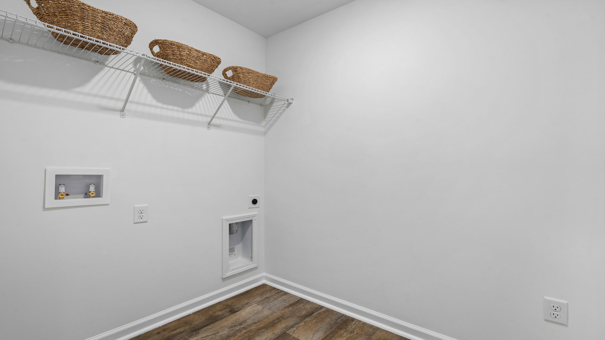 Laundry room with washer and dryer connections and convenient utility space