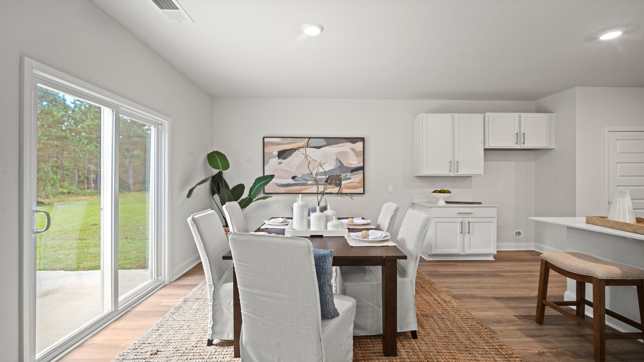 Dining area with the kitchen and living area adjacent.