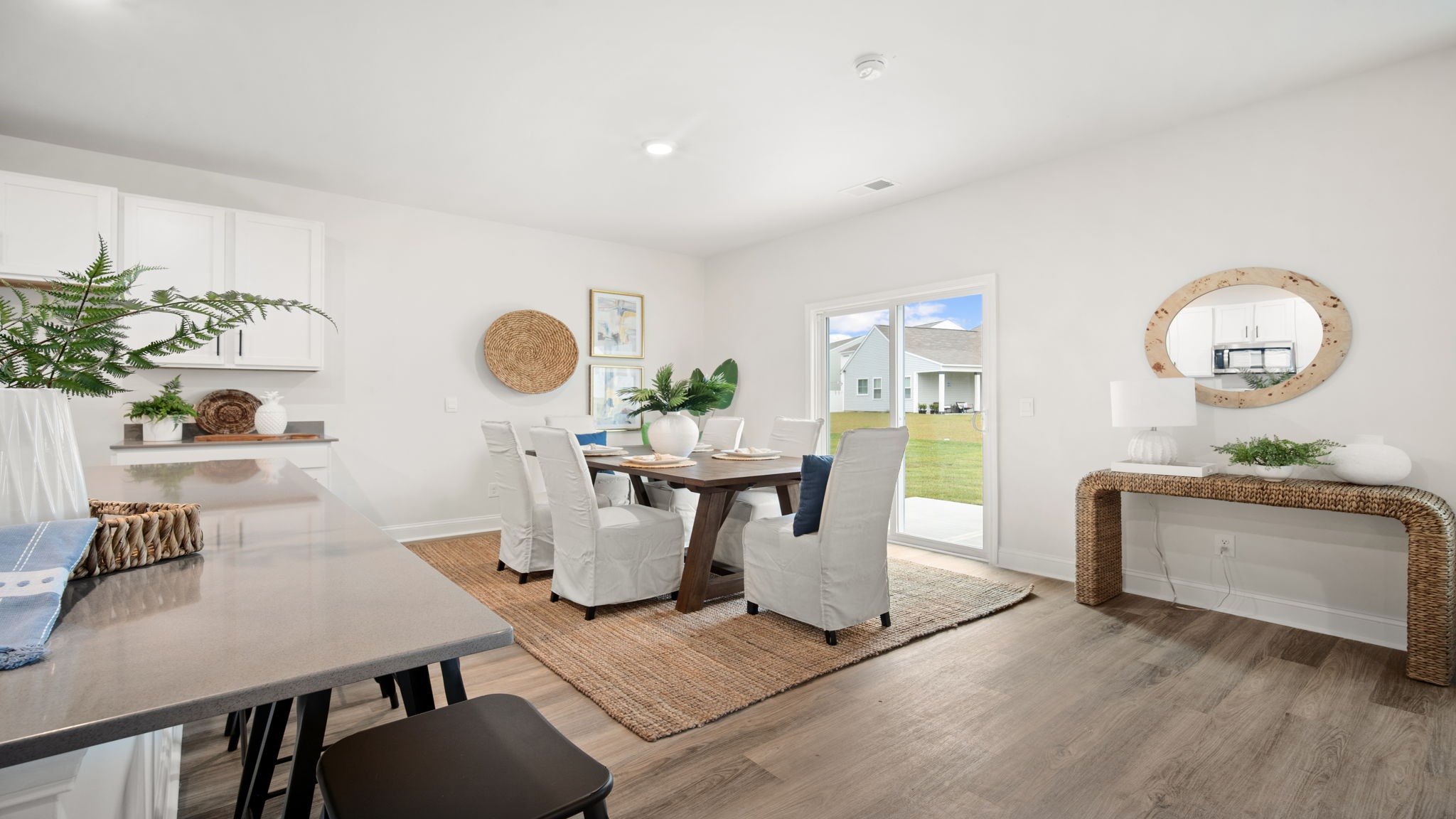 Spacious dining room in the Belhaven showcasing an open-concept layout, ample seating space, and a welcoming atmosphere for family meals and celebrations.