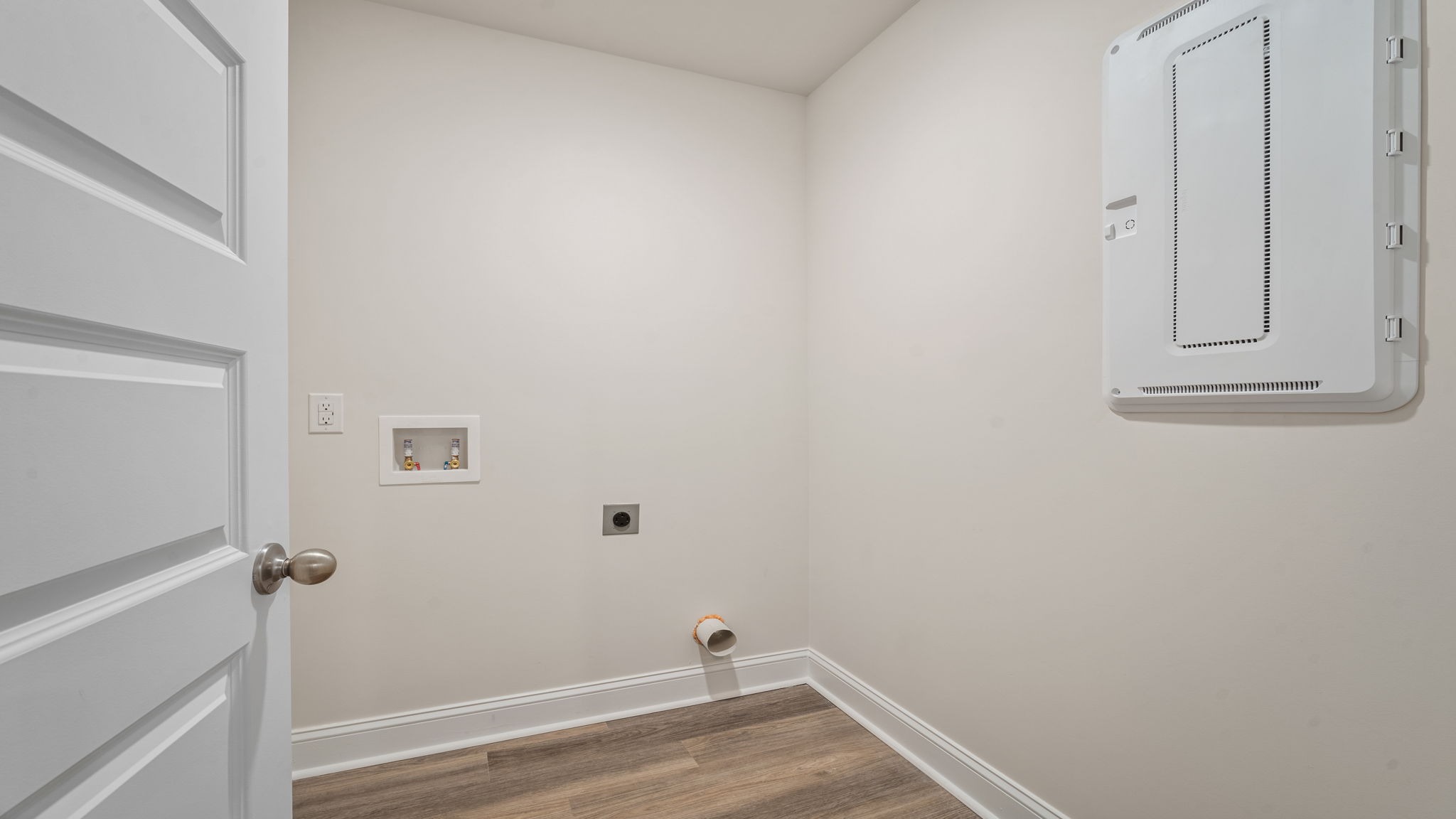 Dedicated laundry room in the Belhaven floorplan by D.R. Horton featuring convenient workspace, storage opportunities, and functional design for everyday household tasks.
