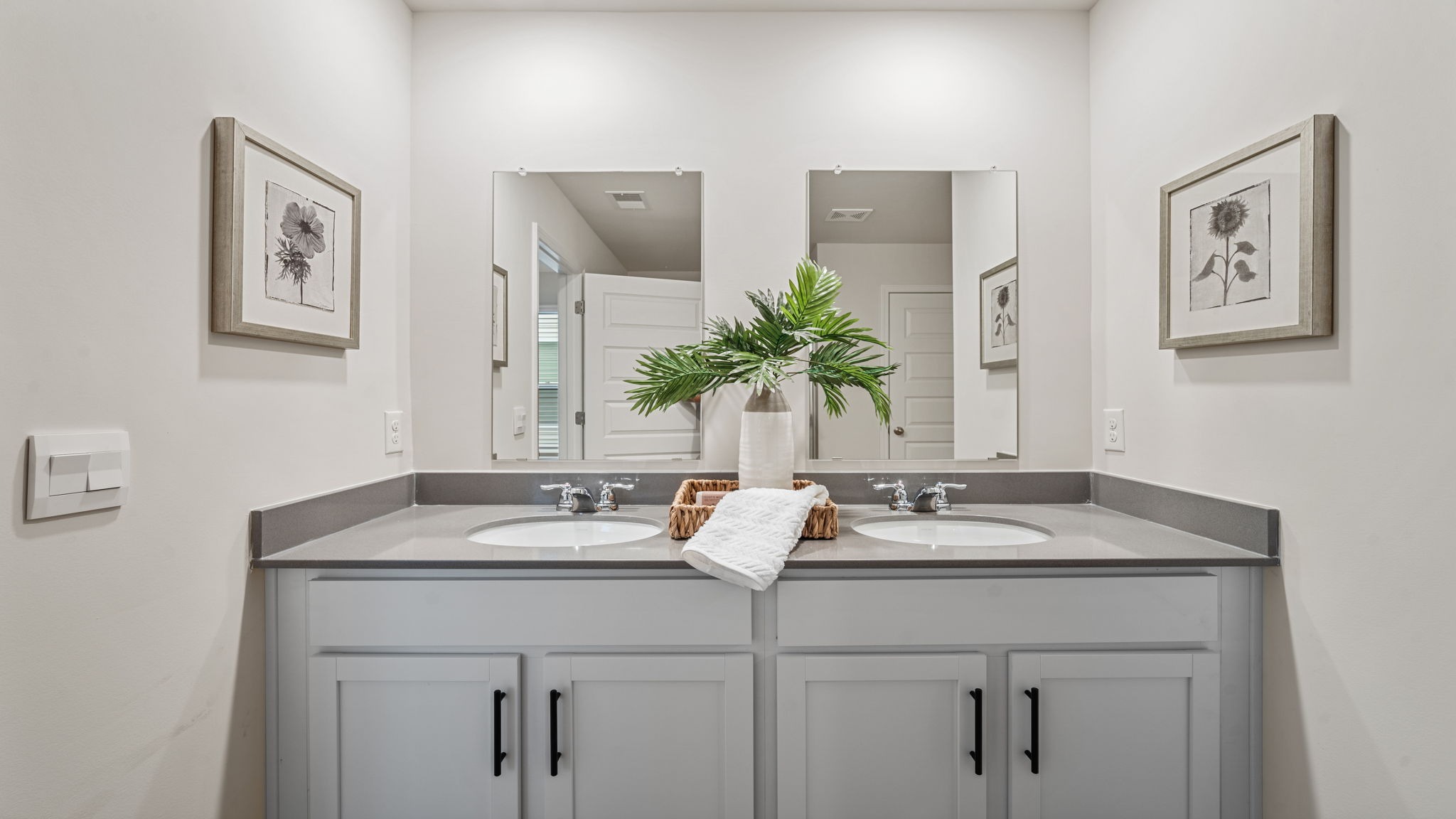 Luxurious primary bath in the Belhaven by D.R. Horton featuring dual sinks, stylish finishes, and a thoughtfully designed layout that enhances everyday routines.