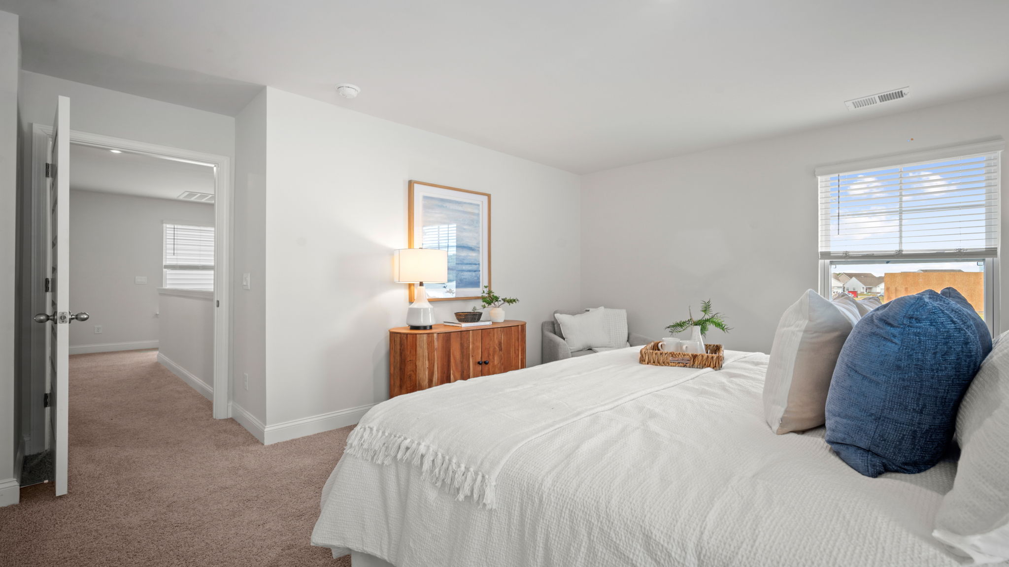 Guest bedroom with a bed and side table