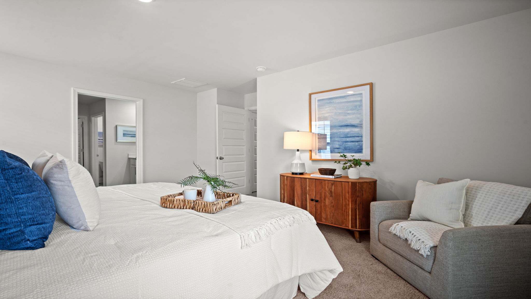 Guest bedroom with a bed and side table
