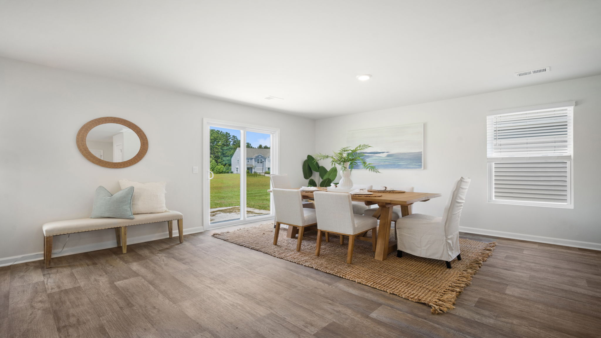 Dining room with table and open flow to living spaces.