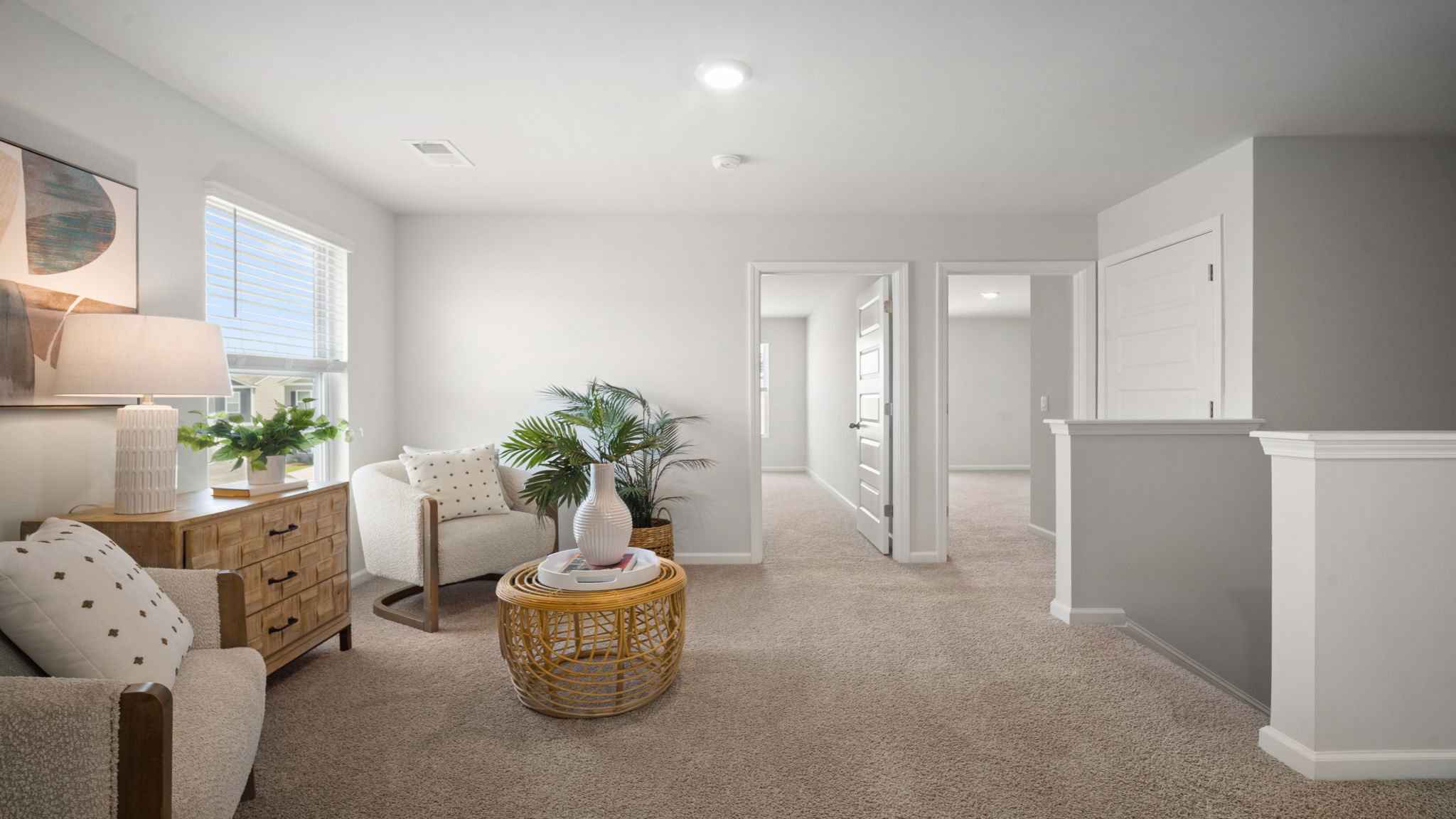 Alternate loft view showing seating and hall access.