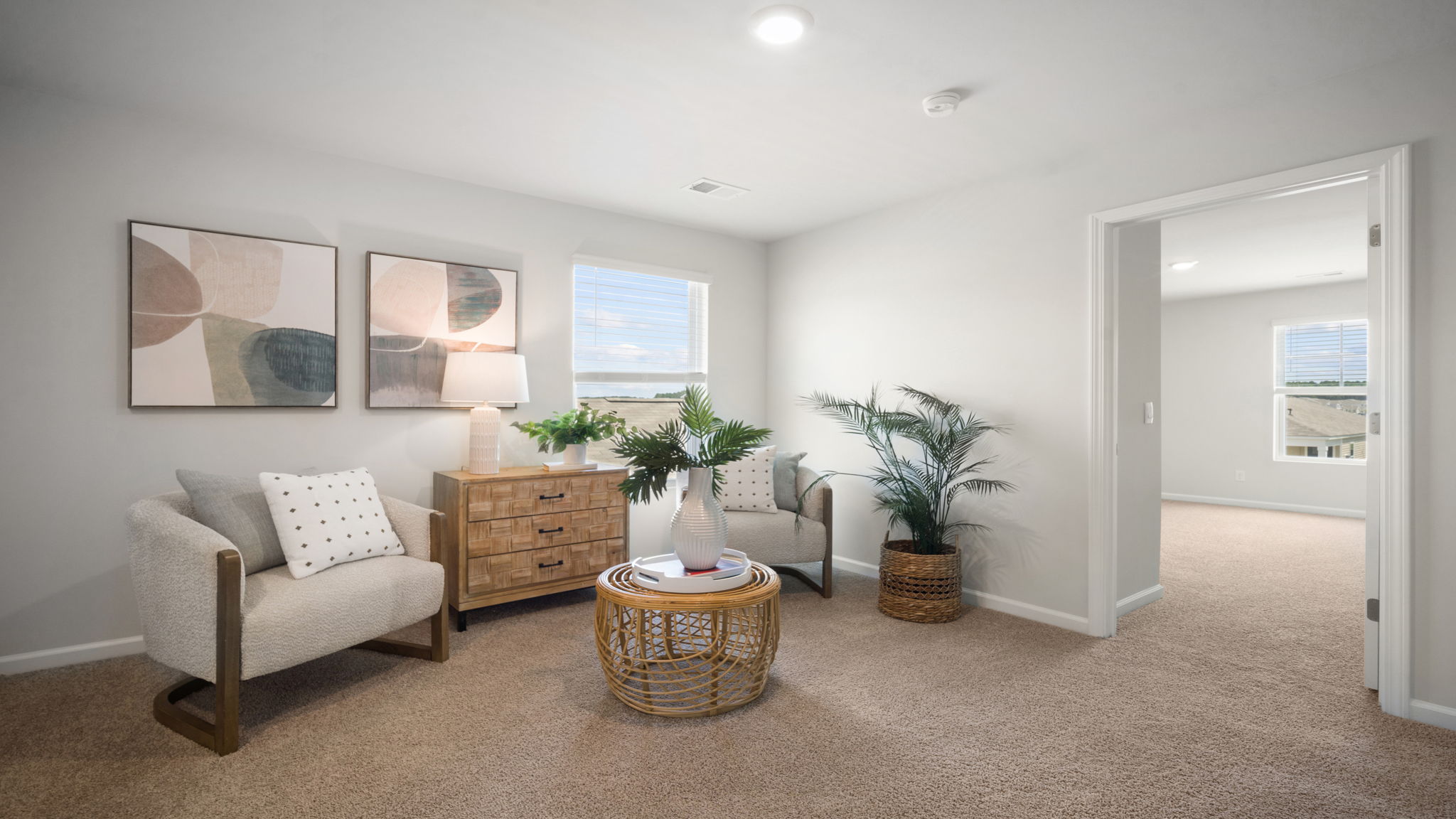 Versatile upstairs loft in the Elston floorplan providing flexible space for a media room, game room, home office, or additional family gathering area.