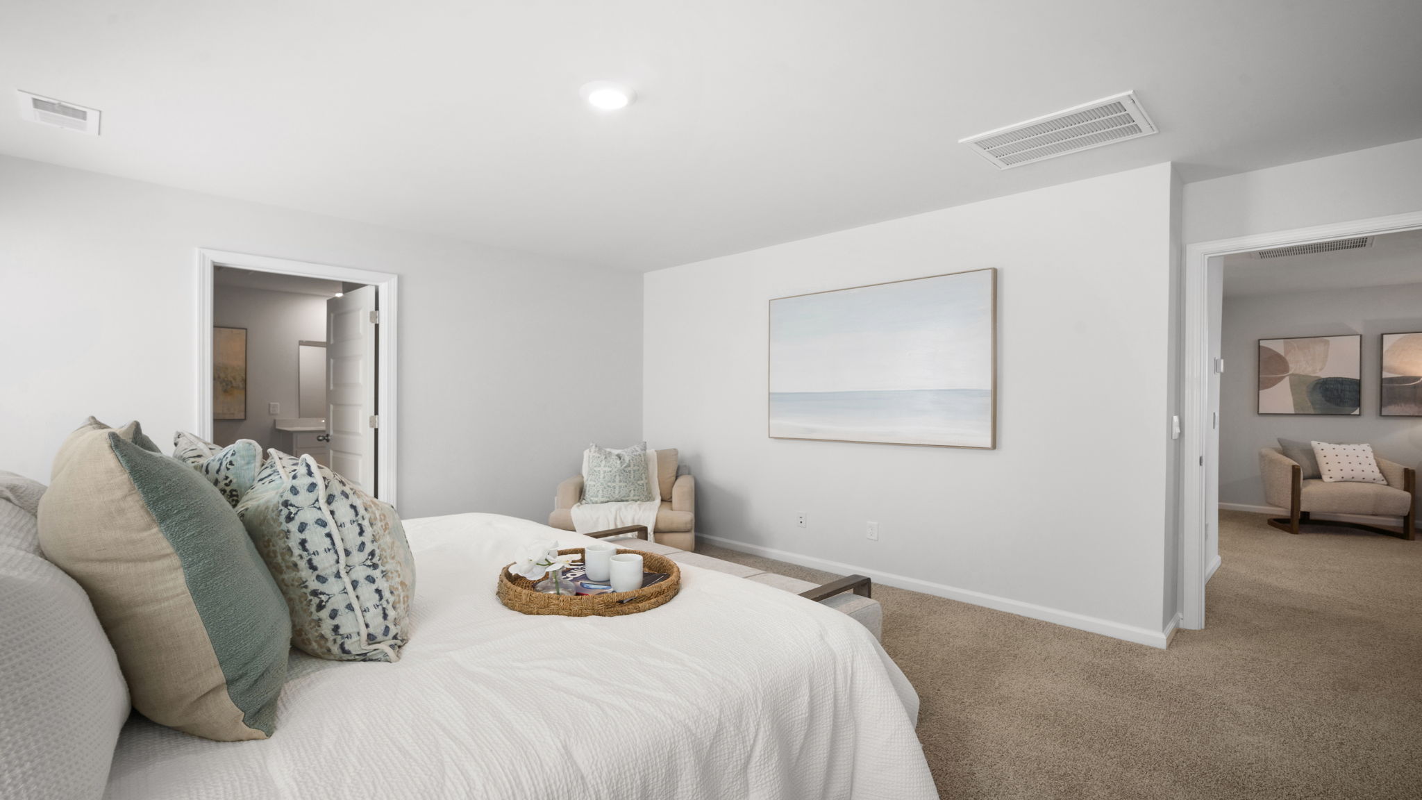 Luxurious primary bedroom in the Elston home offering generous space, natural light, and a peaceful retreat within this beautiful two-story residence.