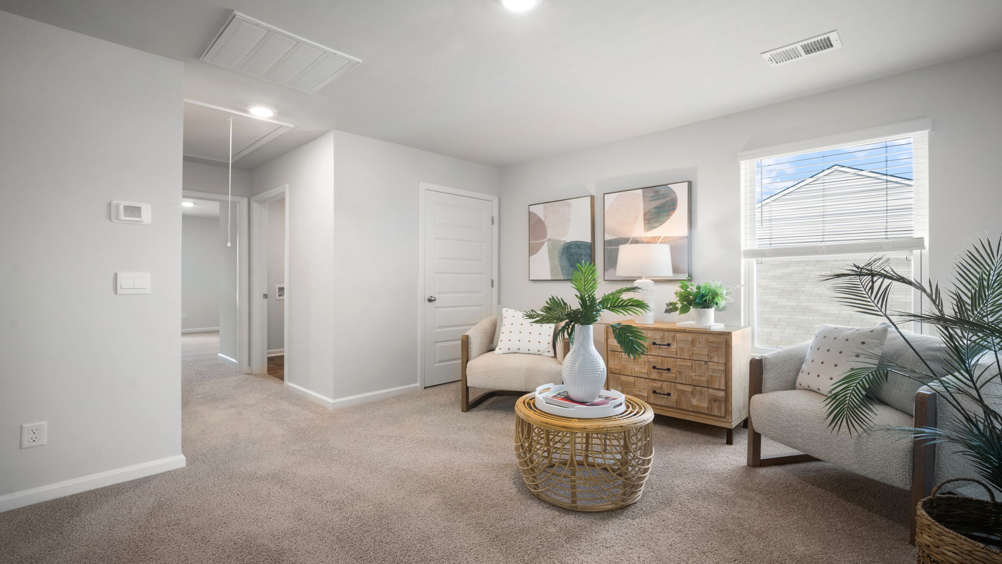 Upstairs loft area with hallway to bedrooms.
