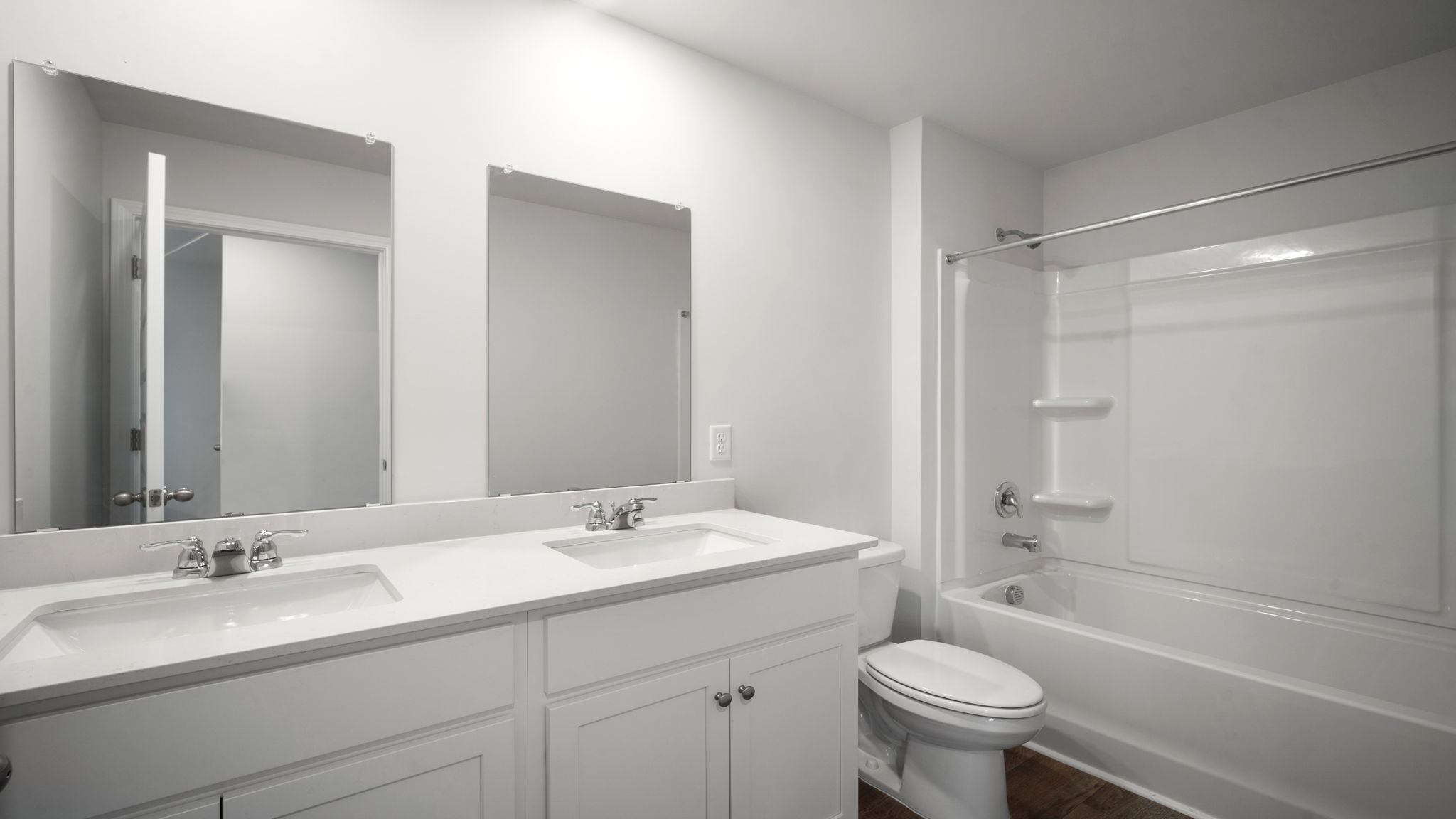 Bathroom with single sink vanity, with shower and tub combination and built in shelving.