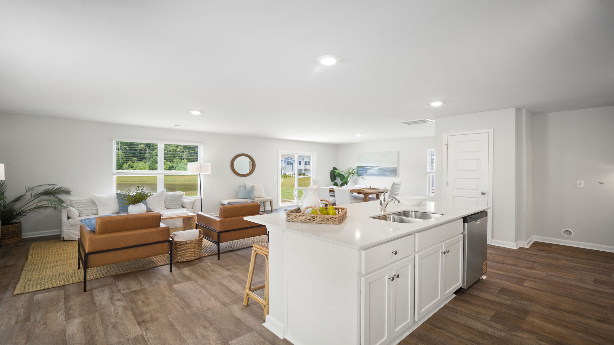 Kitchen island view of the living and dining area