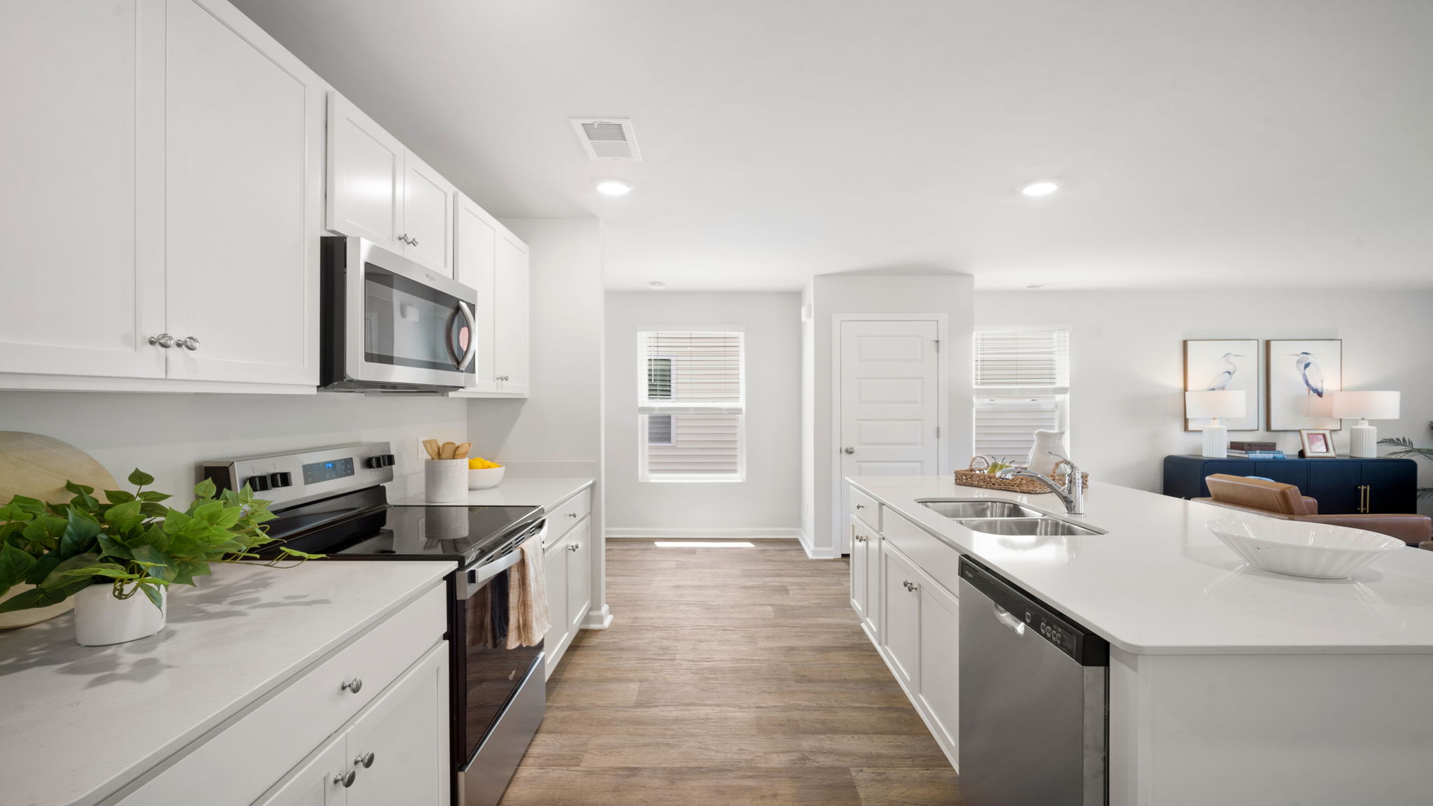 Kitchen walkway with counters on both sides