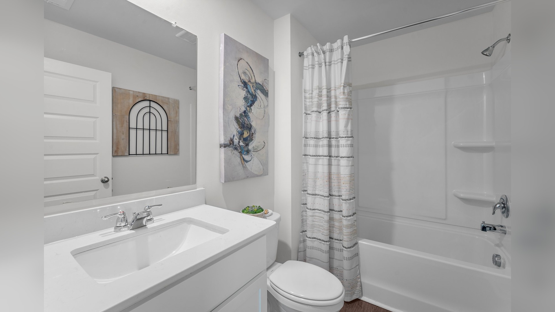 Guest bathroom with a bed