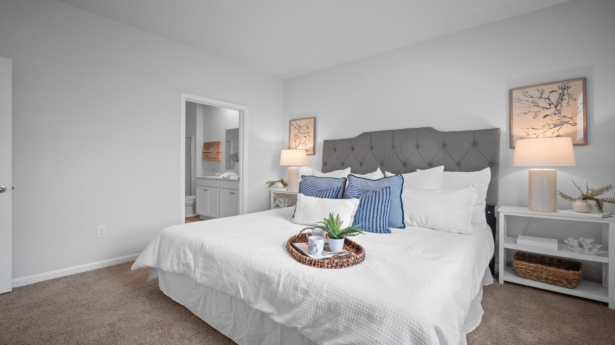 Spacious owner's bedroom featuring elegant finishes and abundant natural light.