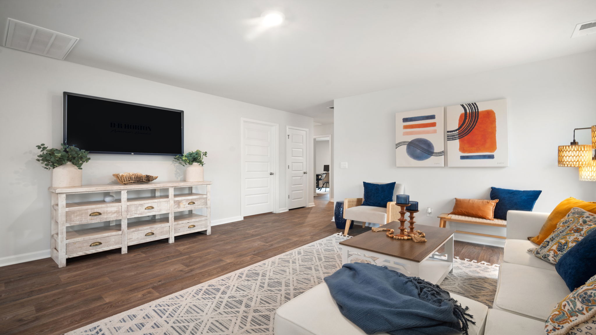Open living room in Lewis floorplan at Rice Hope connecting kitchen and dining area for easy, modern living