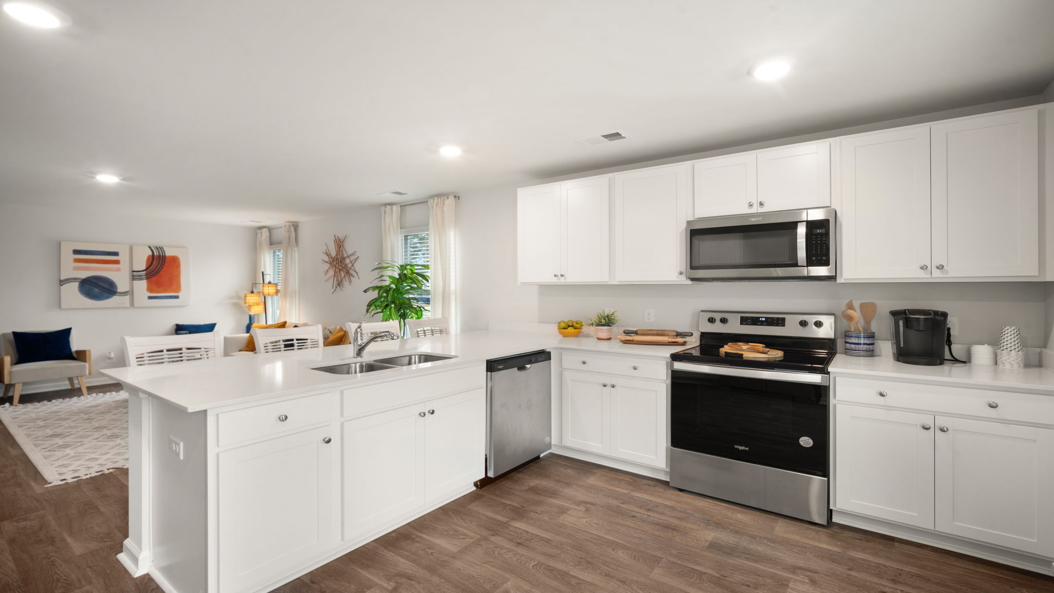 Bright kitchen in D.R. Horton Lewis home overlooking living space, perfect for entertaining and everyday living