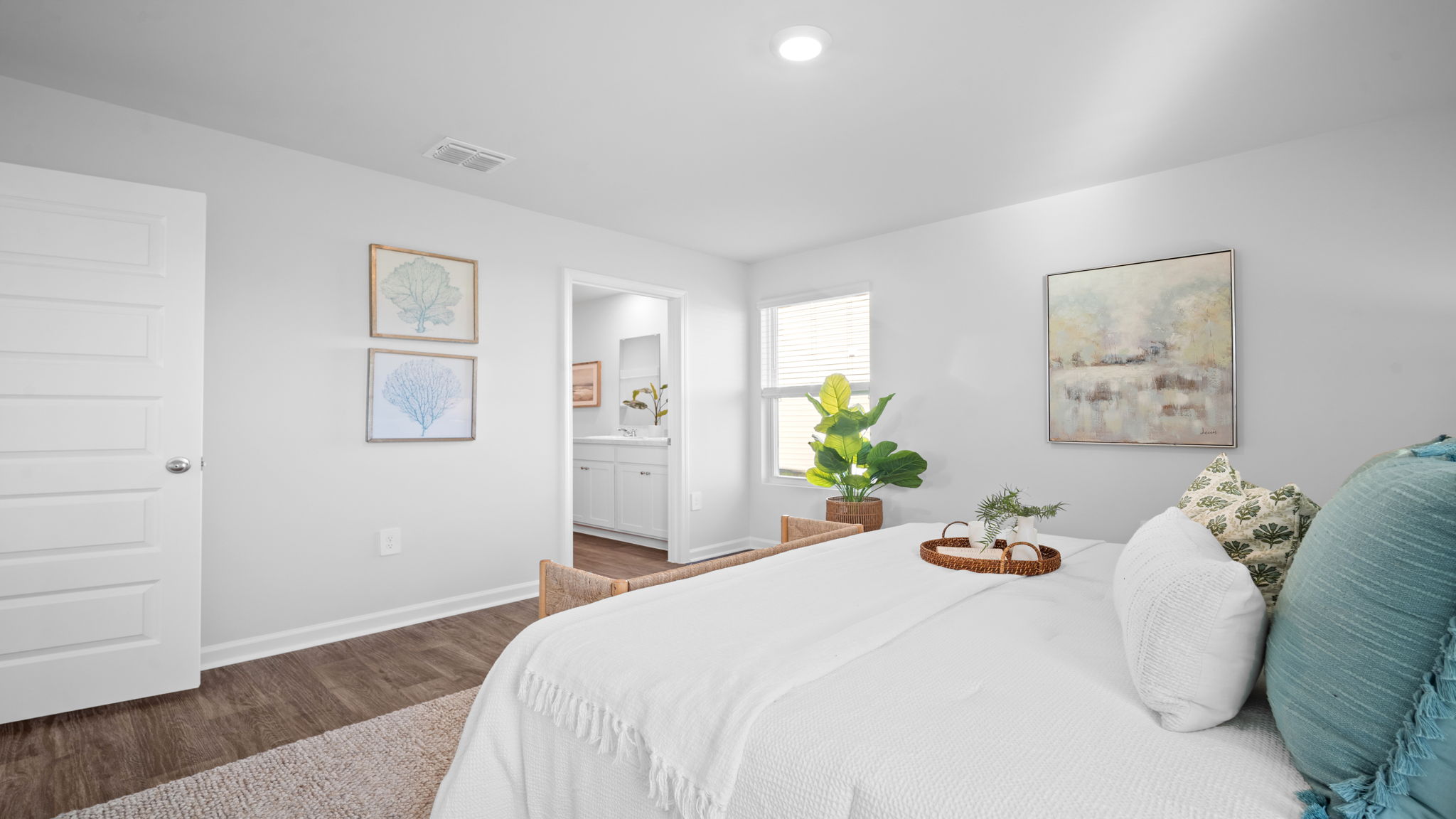 Serene primary suite in the Lewis floor plan at Rice Hope featuring comfort-focused design, spacious accommodations, and modern features for everyday relaxation.