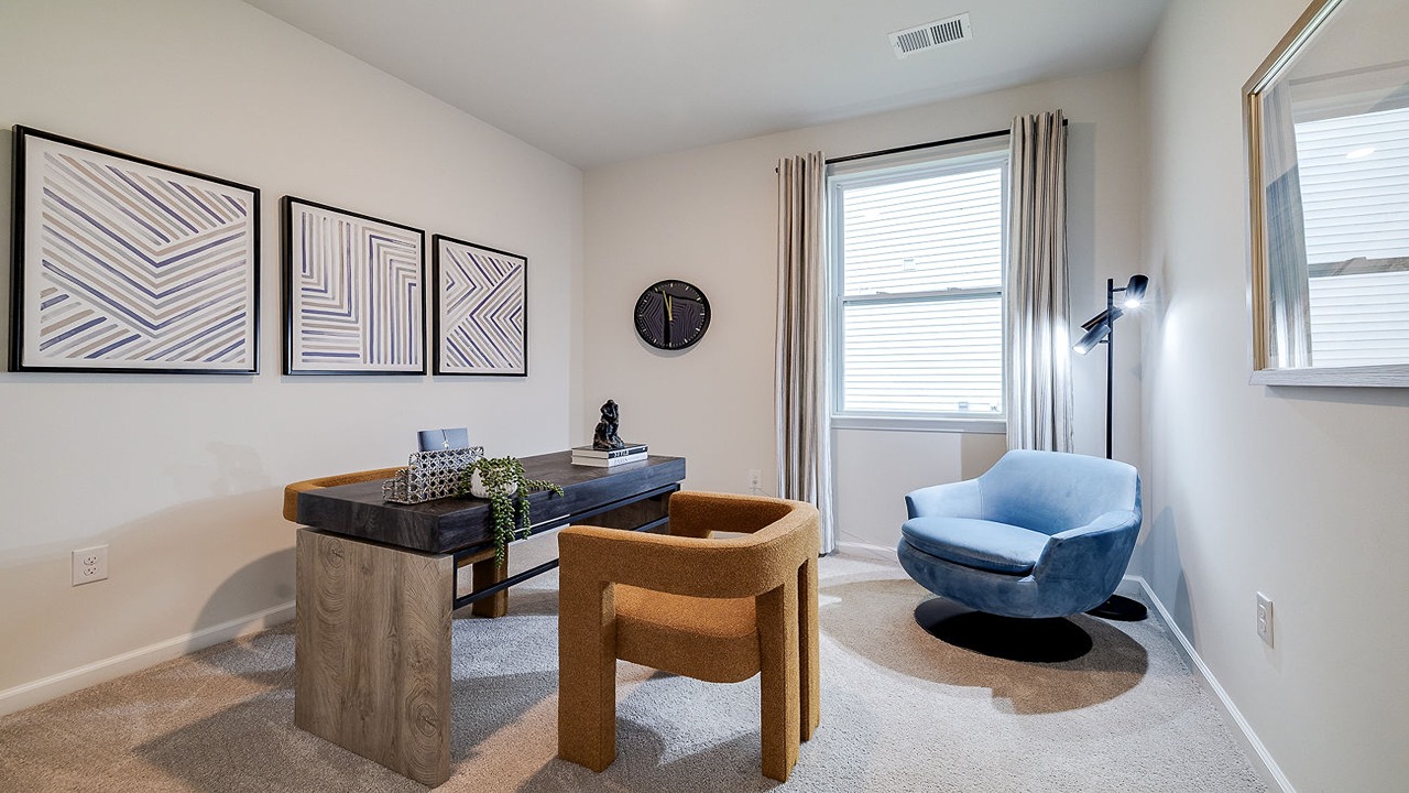 Bright secondary bedroom in the Helena floor plan at Rice Hope showcasing large windows, ample living space, contemporary design elements, and flexible functionality for a variety of lifestyle needs.