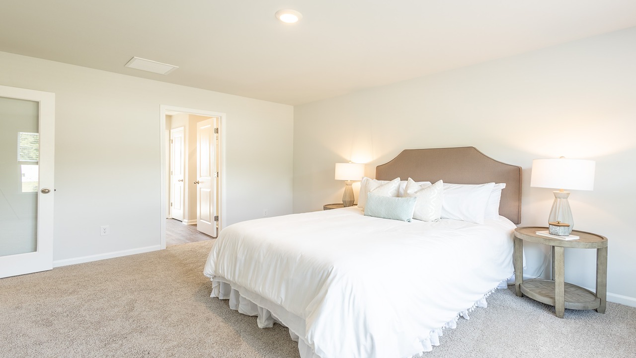 Primary suite natural light of a new construction brandon plan in effingham county rice hope port wentworth