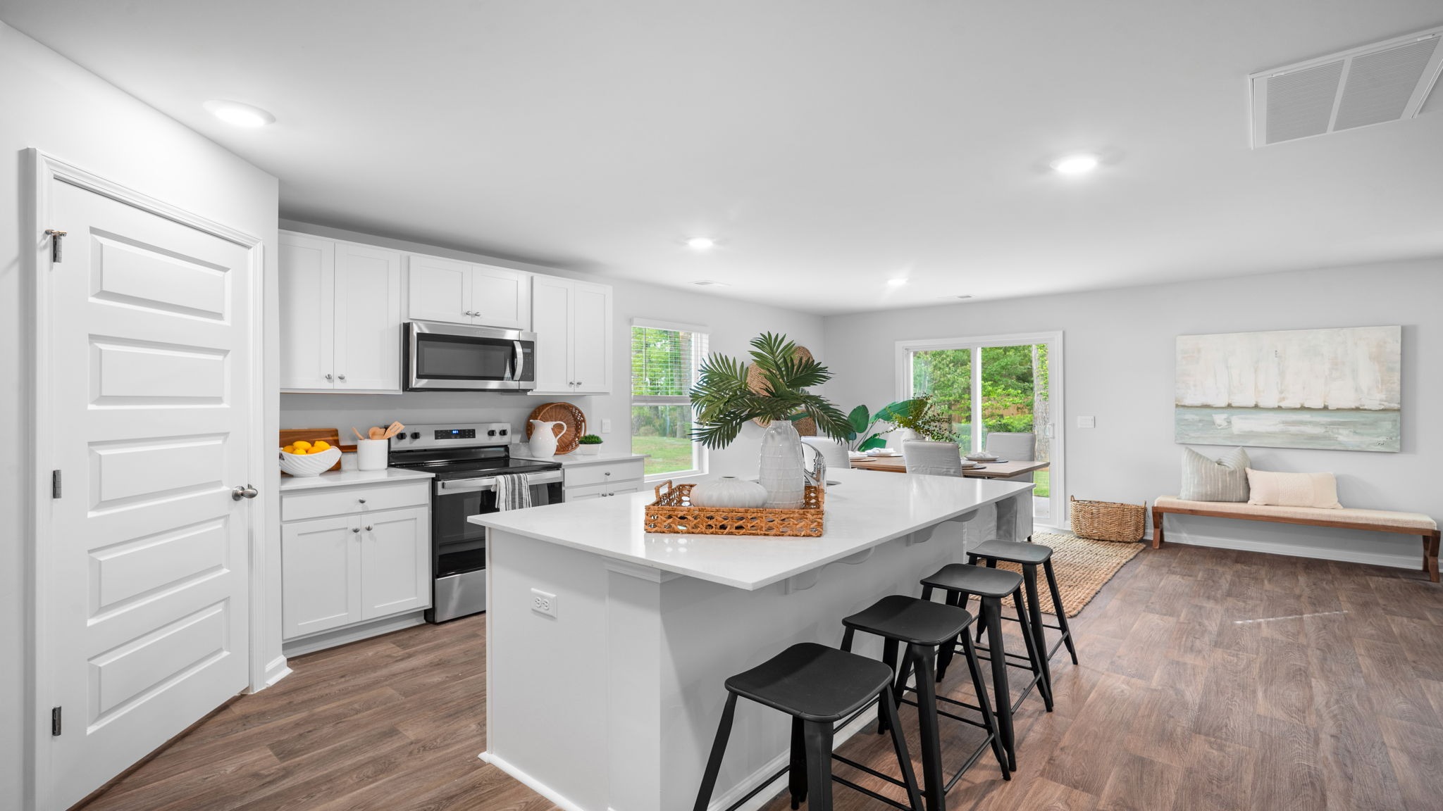 Modern kitchen in D.R. Horton Hartsville home in Rice Hope featuring functional layout, ample cabinetry, and easy access to open living spaces