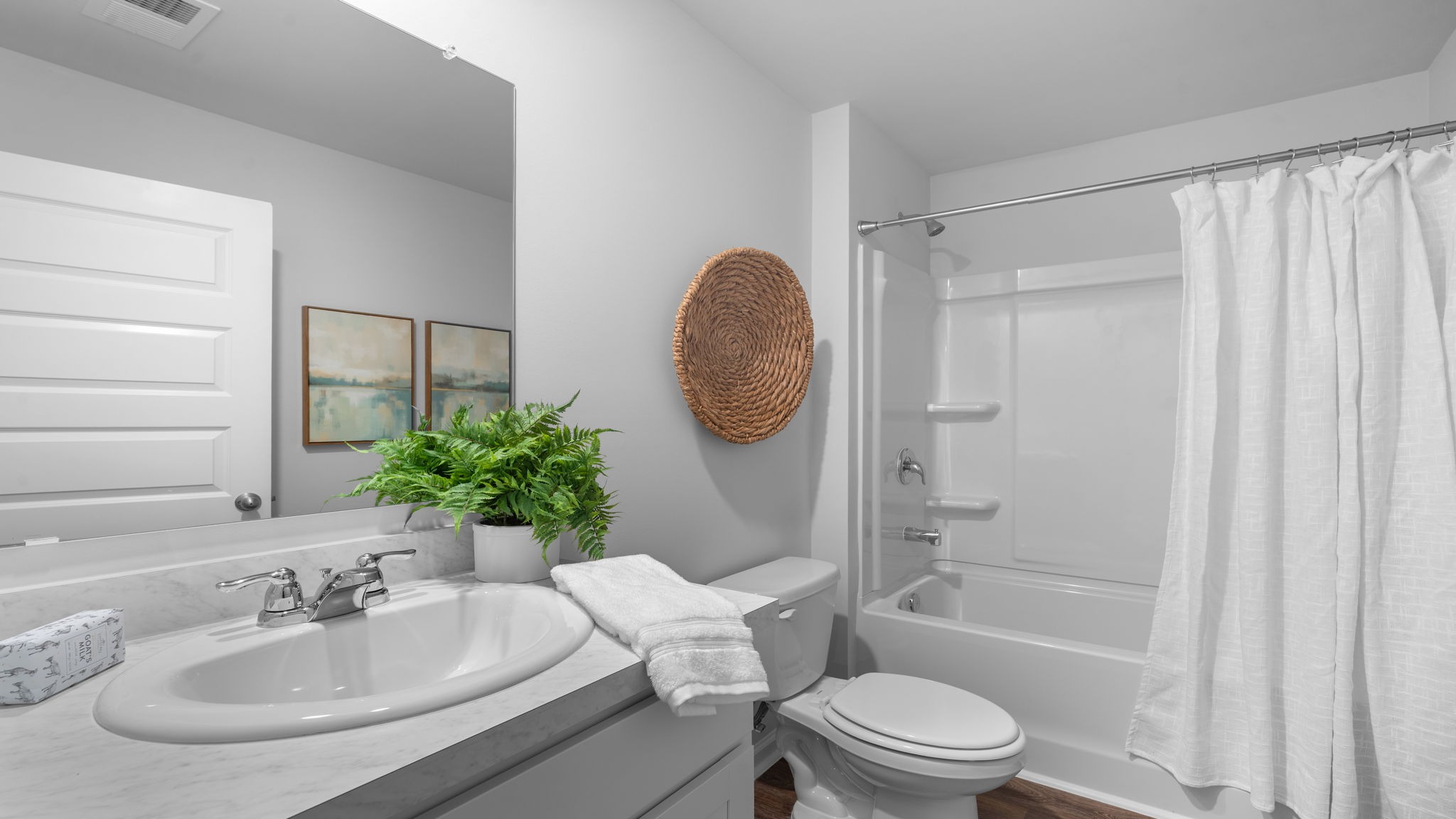 Private primary bathroom in the Hartsville plan in Rice Hope with functional design and convenient access from the owner’s suite