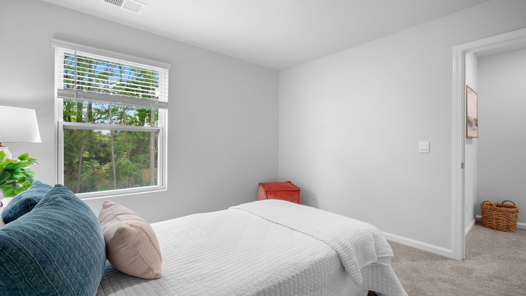 Versatile secondary bedroom in the Hartsville floorplan ideal for guests, home office, or flex space in Rice Hope community