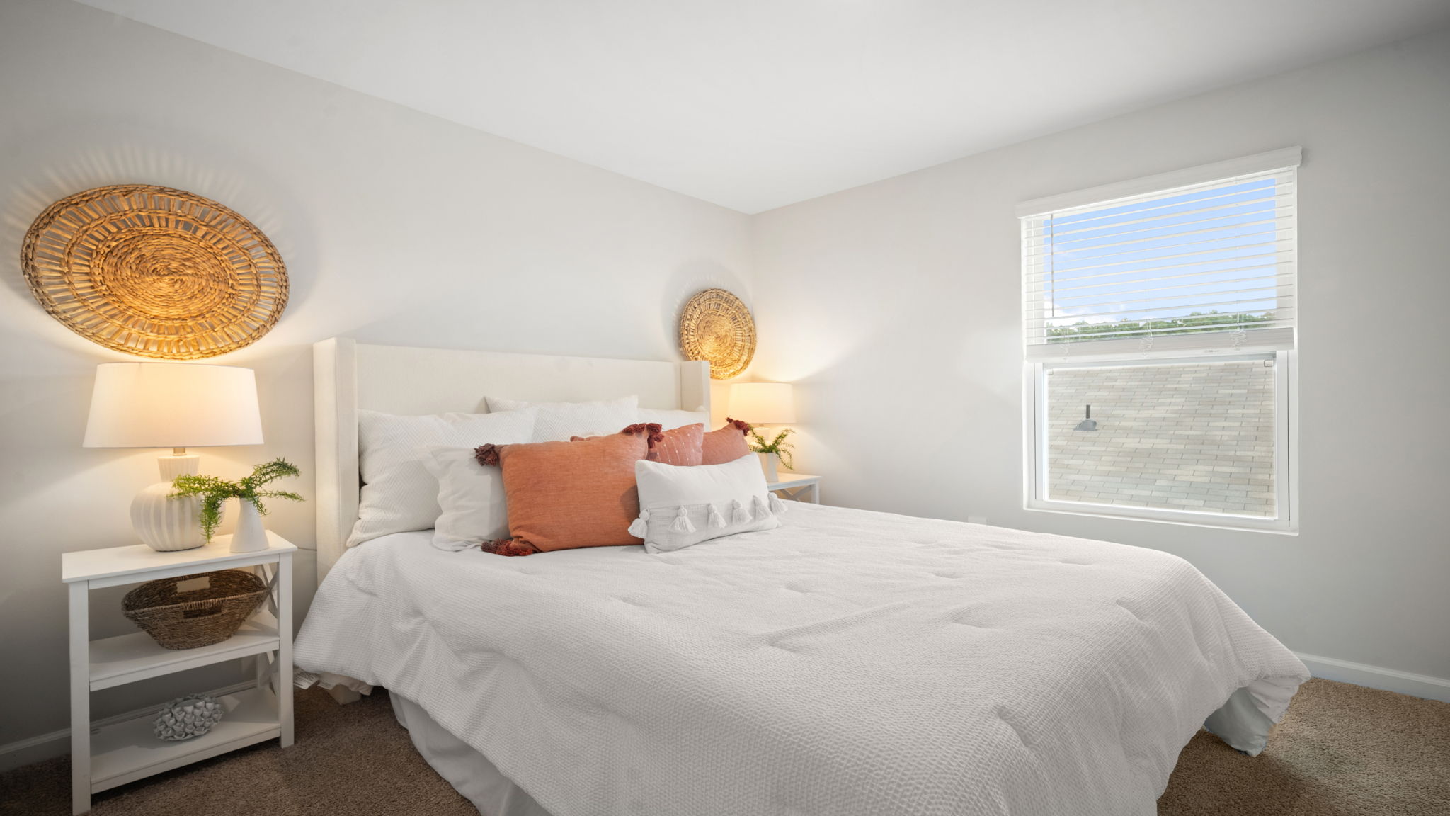 Bedroom with hardwood floors and large single window for natural light.